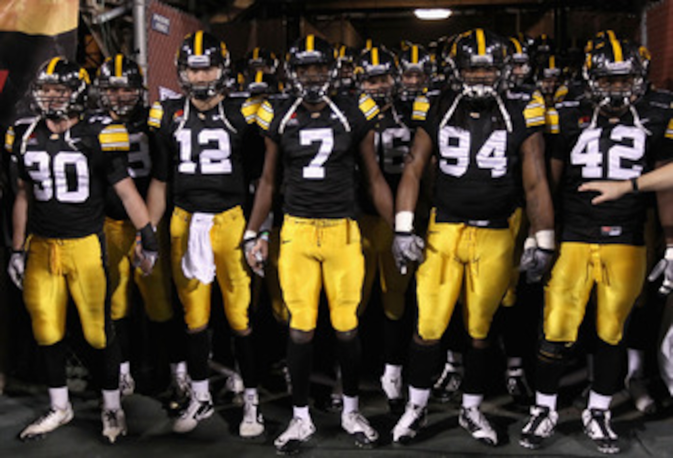 TEMPE, AZ - DECEMBER 28: (L-R) De'Andre Johnson #30, Ricky Stanzi #12, Marvin McNutt #7, Adrian Clayborn #94 and Jeremiha Hunter #42 of the Iowa Hawkeyes prepare to take the field for the Insight Bowl against the Missouri Tigers at Sun Devil Stadium on D TEMPE, AZ - DECEMBER 28: (L-R) De'Andre Johnson #30, Ricky Stanzi #12, Marvin McNutt #7, Adrian Clayborn #94 and Jeremiha Hunter #42 of the Iowa Hawkeyes prepare to take the field for the Insight Bowl against the Missouri Tigers at Sun Devil Stadium on D