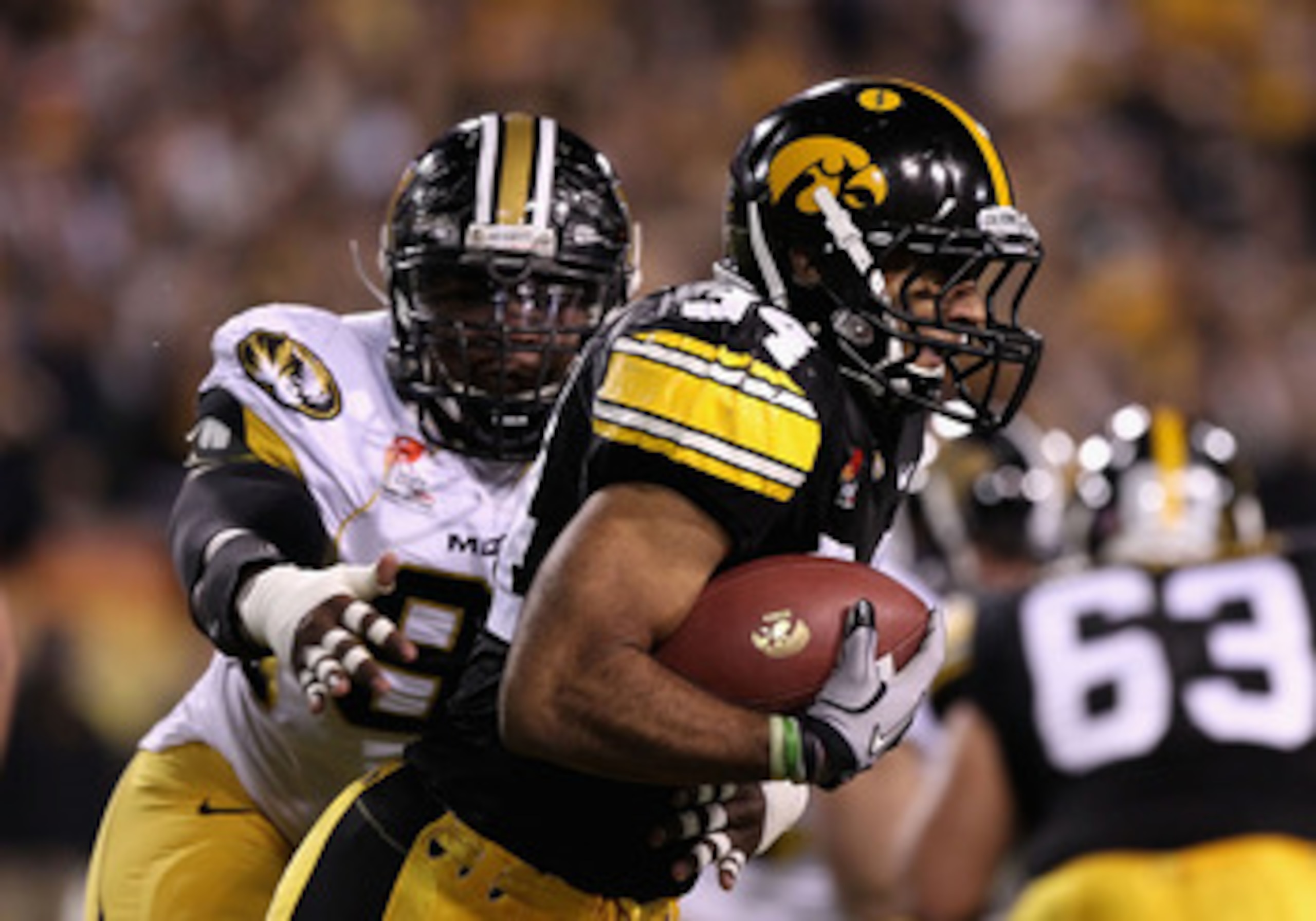 TEMPE, AZ - DECEMBER 28: Runningback Marcus Coker #34 of the Iowa Hawkeyes rushes the football against the Missouri Tigers during the Insight Bowl at Sun Devil Stadium on December 28, 2010 in Tempe, Arizona. (Photo by Christian Petersen/Getty Images) TEMPE, AZ - DECEMBER 28: Runningback Marcus Coker #34 of the Iowa Hawkeyes rushes the football against the Missouri Tigers during the Insight Bowl at Sun Devil Stadium on December 28, 2010 in Tempe, Arizona. (Photo by Christian Petersen/Getty Images)