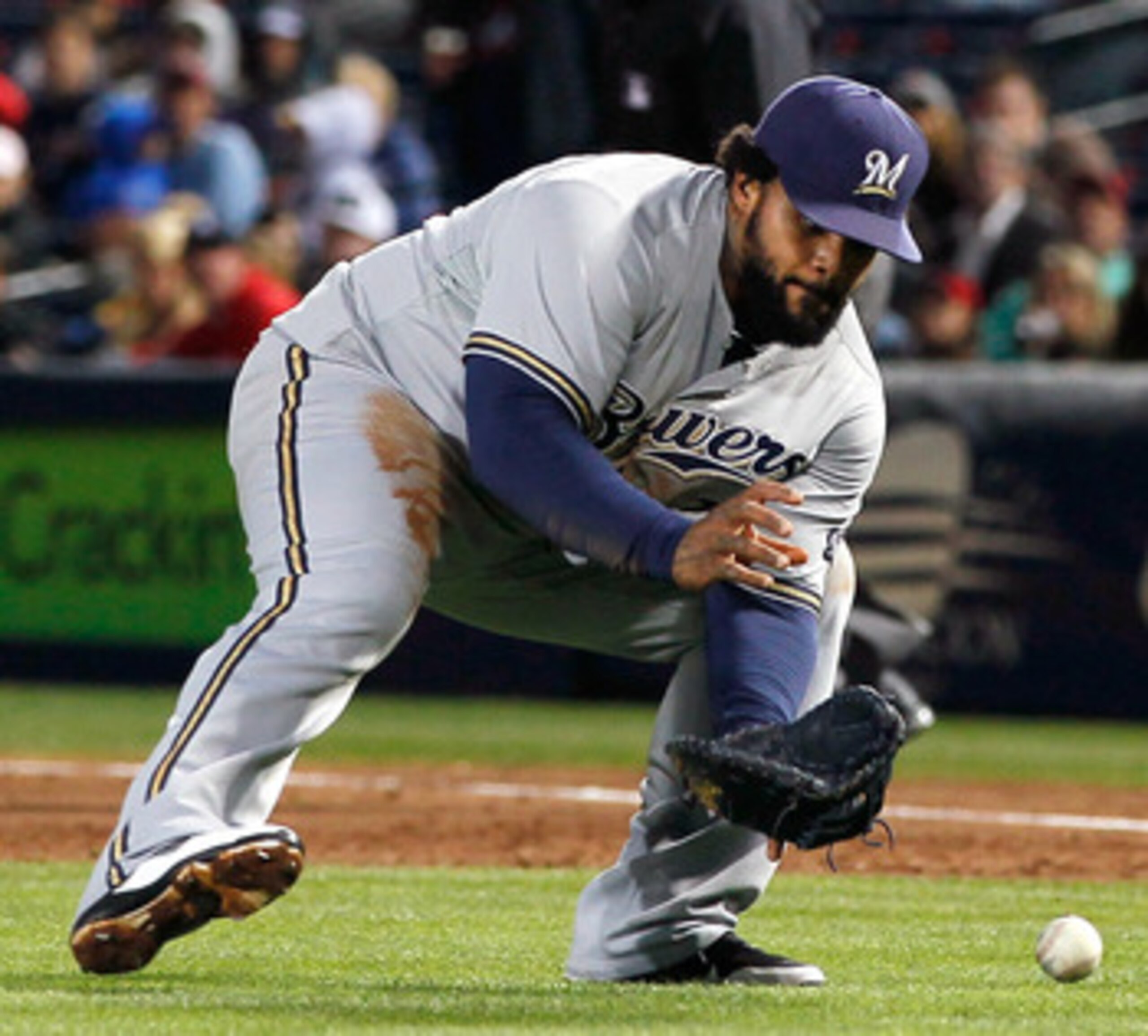 ATLANTA, GA - MAY 04:  Prince Fielder #28 of the Milwaukee Brewers fields a bunt by Tim Hudson #15 of the Atlanta Braves in the second inning at Turner Field on May 4, 2011 in Atlanta, Georgia.  (Photo by Kevin C. Cox/Getty Images)