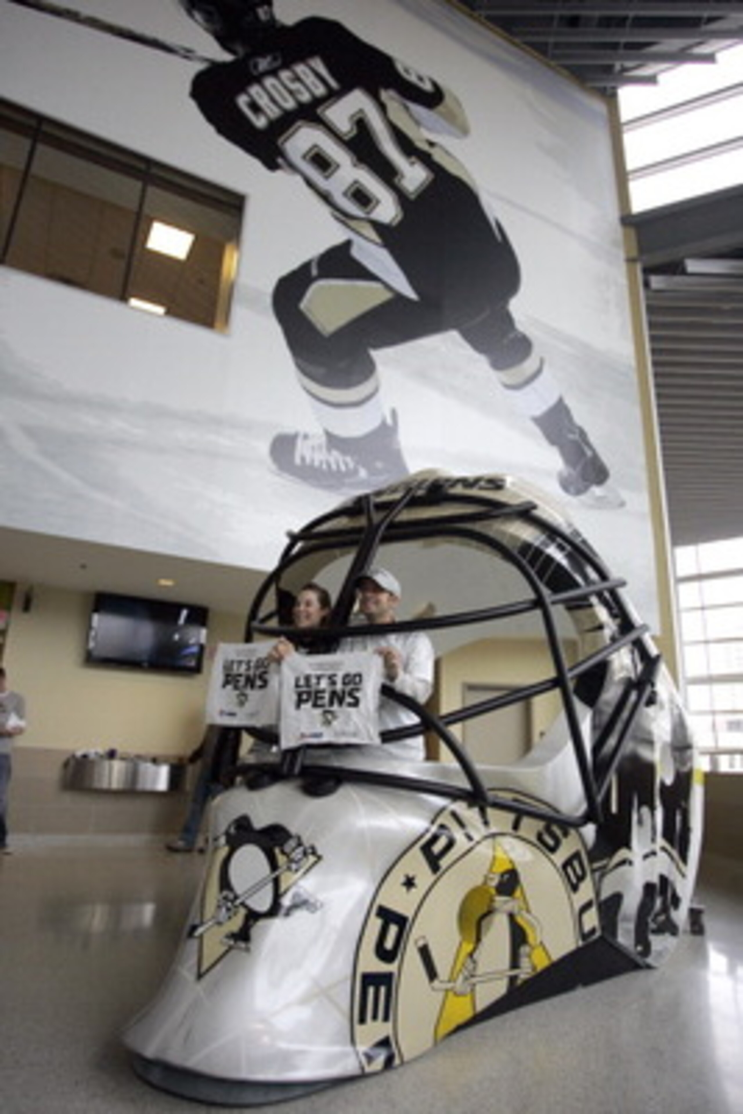PITTSBURGH, PA - APRIL 23:  Pittsburgh Penguins fans pose for a photo in a giant goalie mask before the start of the game between the Pittsburgh Penguins and the Tampa Bay Lightning in Game Five of the Eastern Conference Quarterfinals during the 2011 NHL