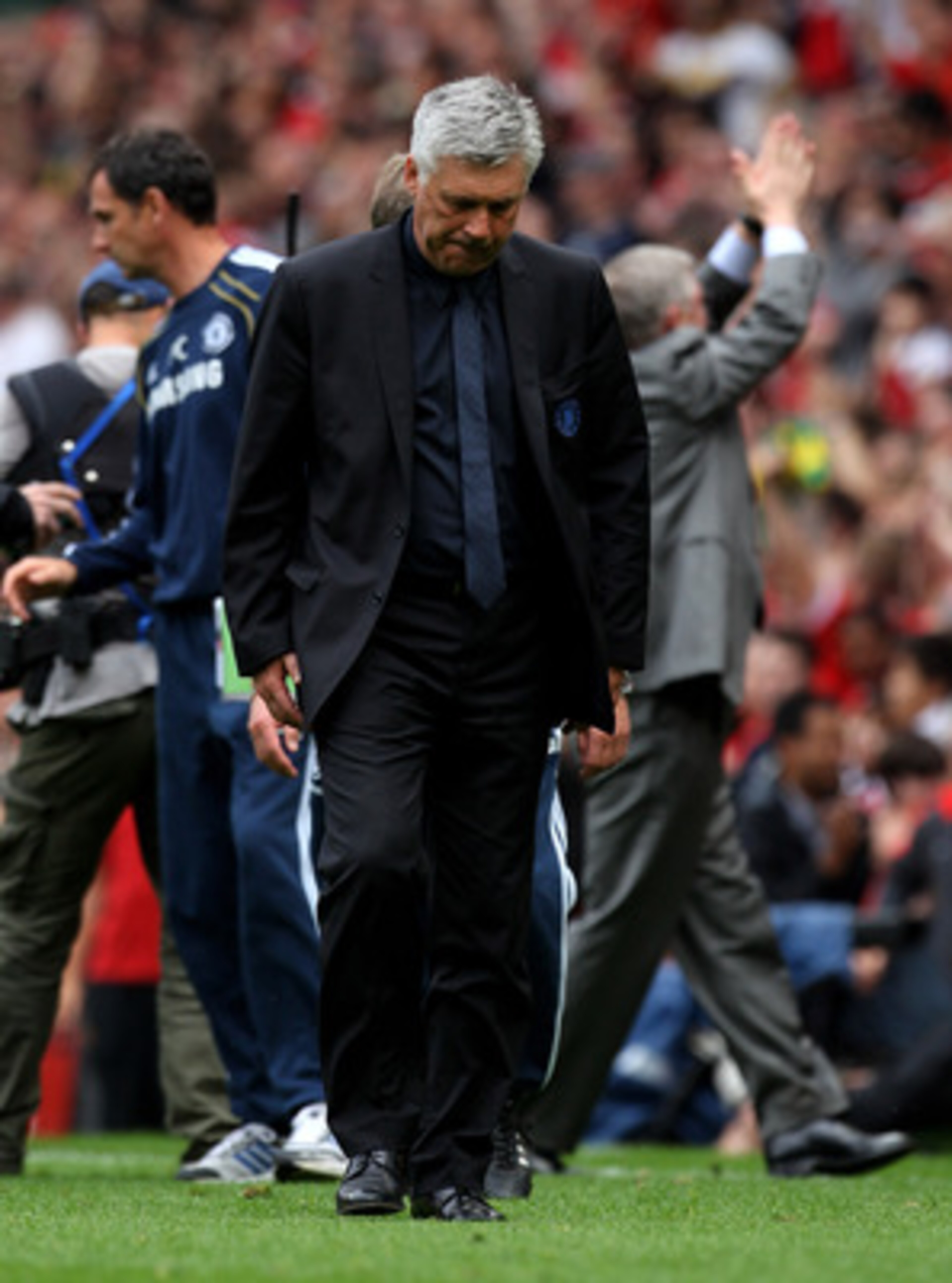 MANCHESTER, ENGLAND - MAY 08:  Chelsea Manager Carlo Ancelotti heads for the dressing room at the end of the Barclays Premier League match between Manchester United and Chelsea at Old Trafford on May 8, 2011 in Manchester, England.  (Photo by Alex Livesey