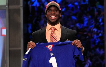 NEW YORK, NY - APRIL 28:  Prince Amukamara, #19 overall pick by the New York Giants, holds up a jersey on stage during the 2011 NFL Draft at Radio City Music Hall on April 28, 2011 in New York City.  (Photo by Chris Trotman/Getty Images)