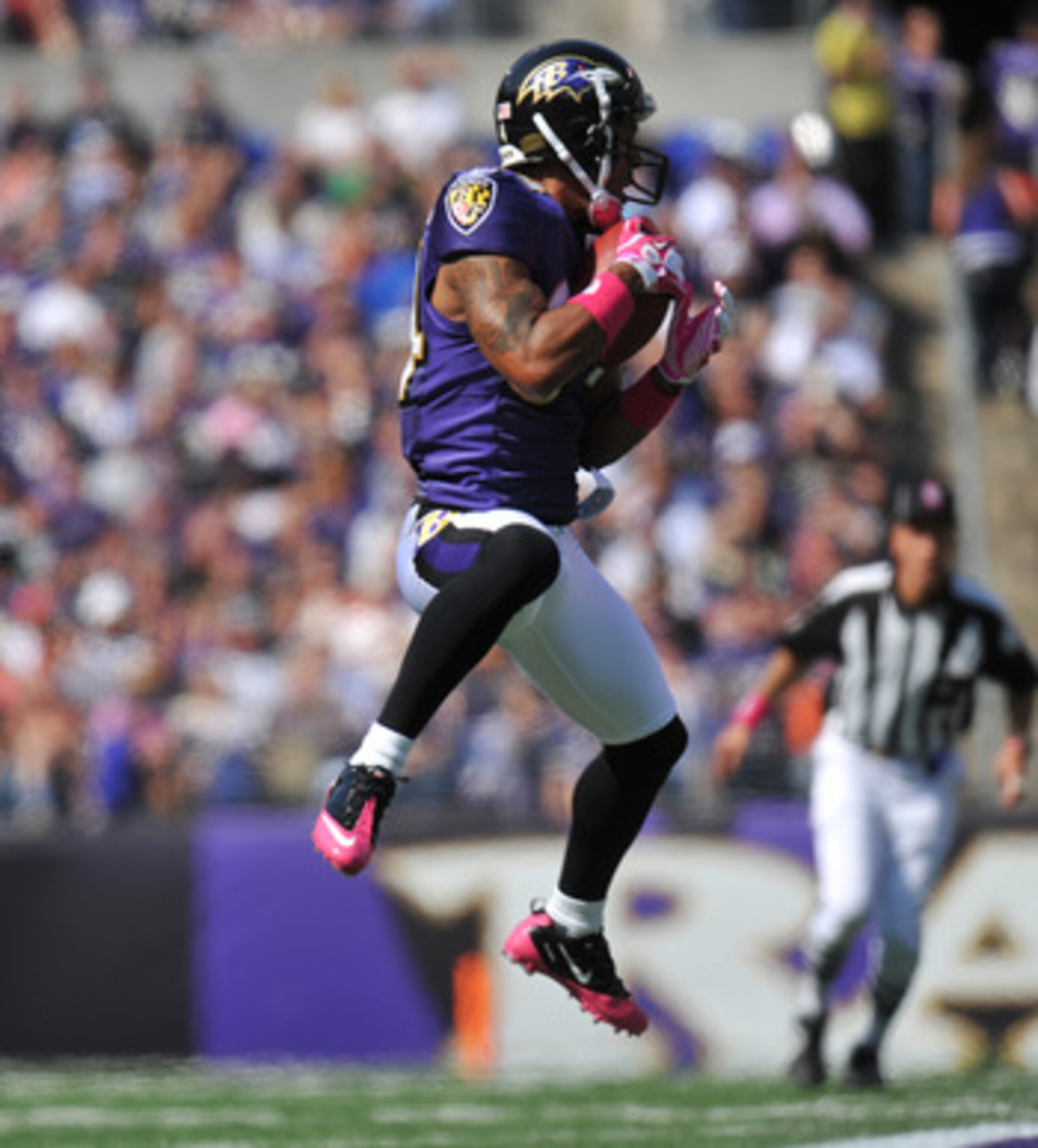 BALTIMORE, MD - OCTOBER 10:  T.J. Houshmandzadeh #84 of the Baltimore Ravens makes a catch against the Denver Broncos at M&T Bank Stadium on October 10, 2010 in Baltimore, Maryland. Players wore pink in recognition of Breast Cancer Awareness Month. The Ra