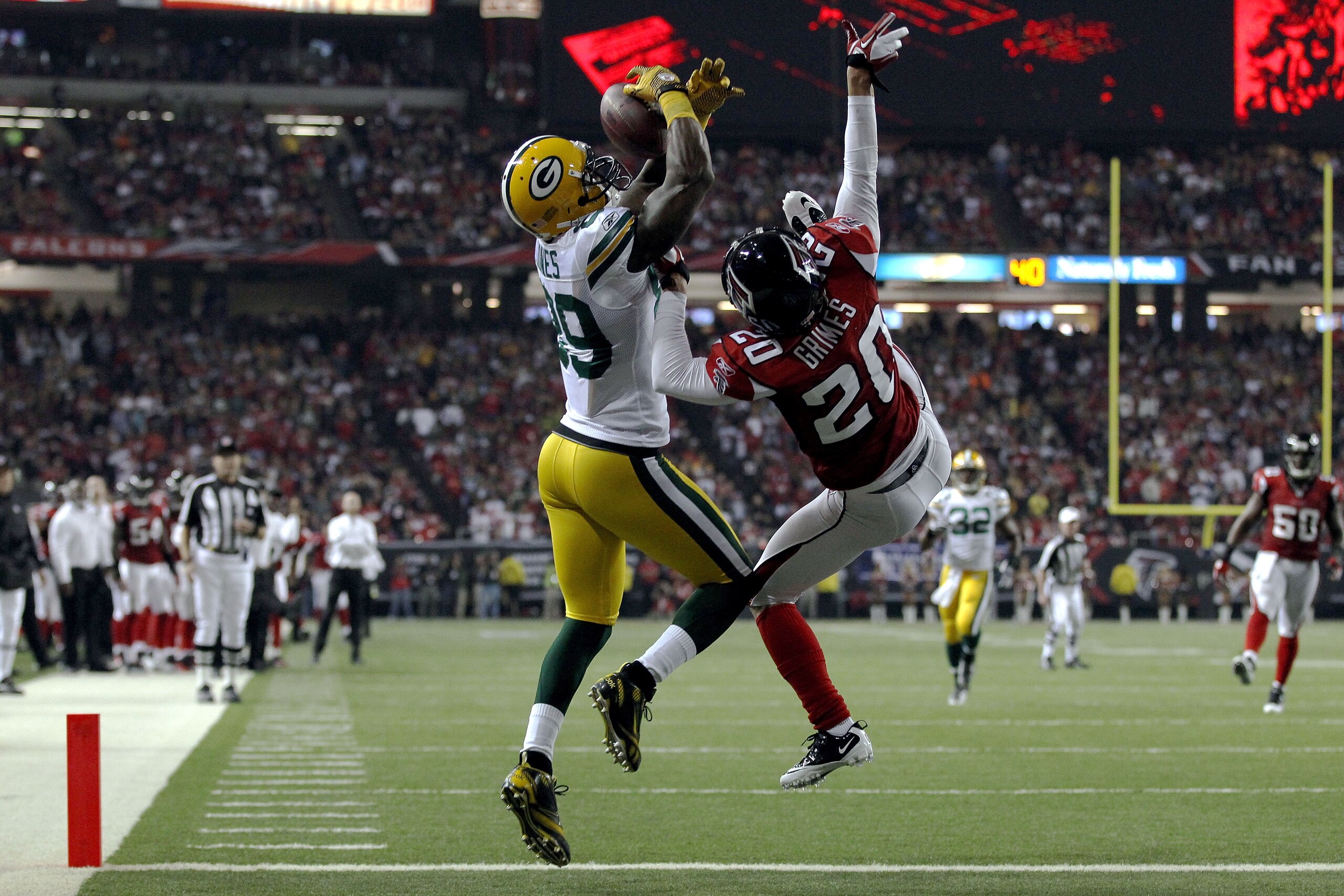 ATLANTA, GA - JANUARY 15: James Jones #89 of the Green Bay Packers scores a 20-yard touchdown reception in the second quarter against Brent Grimes #20 of the Atlanta Falcons during their 2011 NFC divisional playoff game at Georgia Dome on January 15, 201 ATLANTA, GA - JANUARY 15: James Jones #89 of the Green Bay Packers scores a 20-yard touchdown reception in the second quarter against Brent Grimes #20 of the Atlanta Falcons during their 2011 NFC divisional playoff game at Georgia Dome on January 15, 201