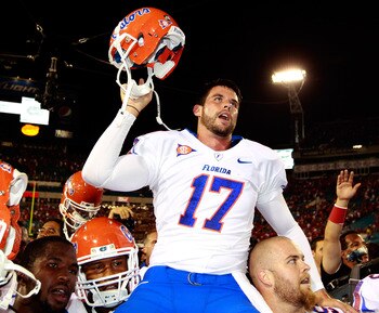 JACKSONVILLE, FL - OCTOBER 30:  Chas Henry #17 of the Florida Gators raises his helmet in vicrtory following the game against the Georgia Bulldogs at EverBank Field on October 30, 2010 in Jacksonville, Florida.  (Photo by Sam Greenwood/Getty Images)