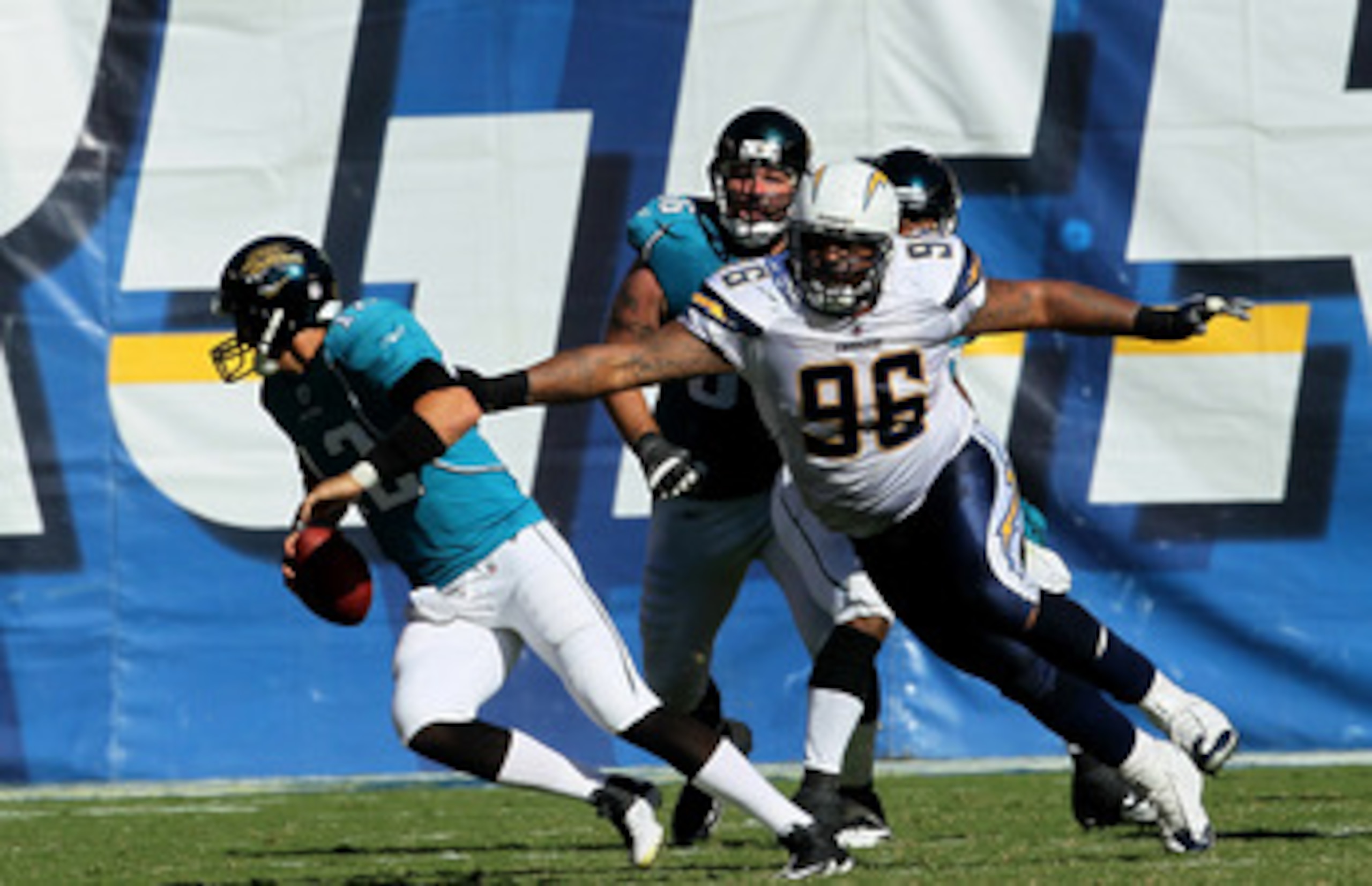 SAN DIEGO - SEPTEMBER 19: Defensive lineman Travis Johnson #96 of the San Diego Chargers pursues quarterback Luke McCowen #12 of of the Jacksonville Jaguars at Qualcomm Stadium on September 19, 2010 in San Diego, California. The Chargers won 38-13.  (Phot