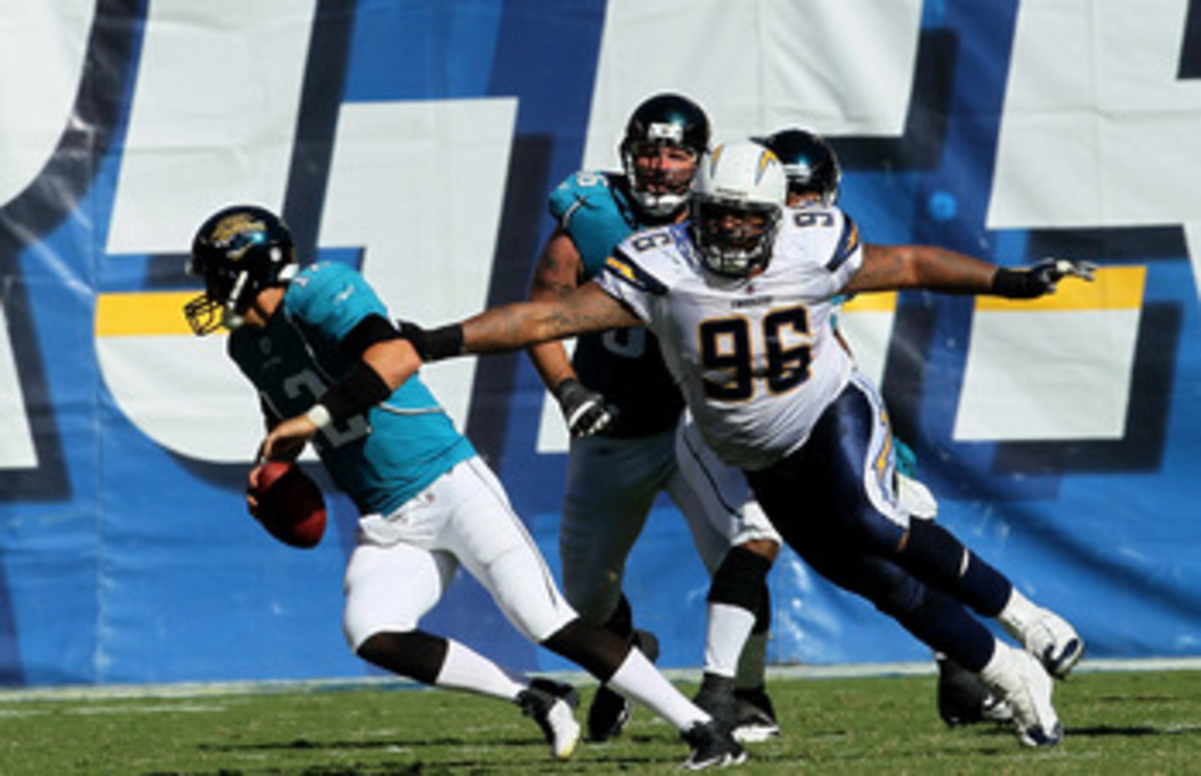 SAN DIEGO - SEPTEMBER 19: Defensive lineman Travis Johnson #96 of the San Diego Chargers pursues quarterback Luke McCowen #12 of of the Jacksonville Jaguars at Qualcomm Stadium on September 19, 2010 in San Diego, California. The Chargers won 38-13.  (Phot