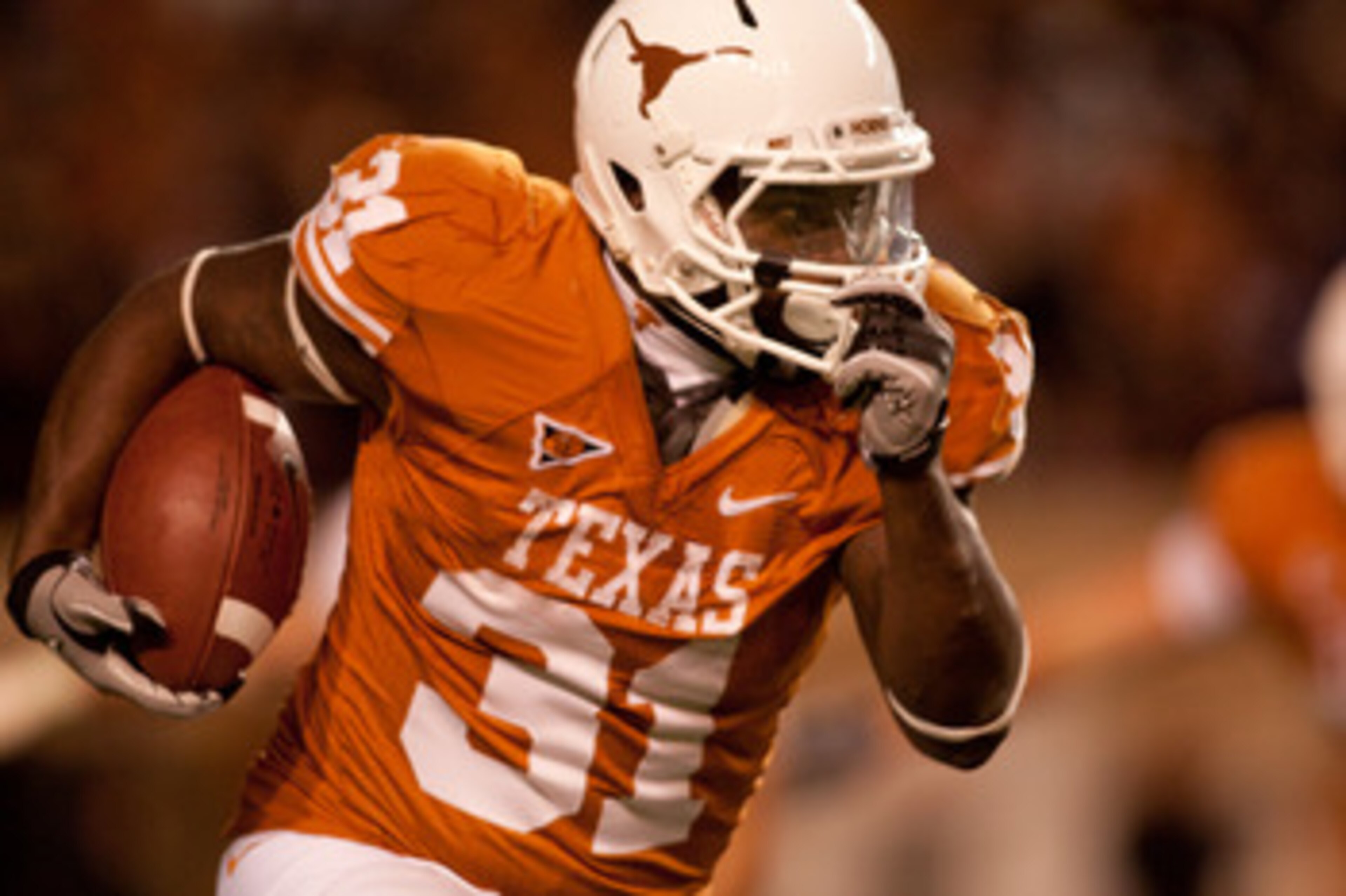 AUSTIN, TX - NOVEMBER 25:  Running back Cody Johnson #31 of the University of Texas rushes during the second half against Texas A&M at Darrell K. Royal-Texas Memorial Stadium on November 25, 2010 in Austin, Texas. (Photo by Darren Carroll/Getty Images)