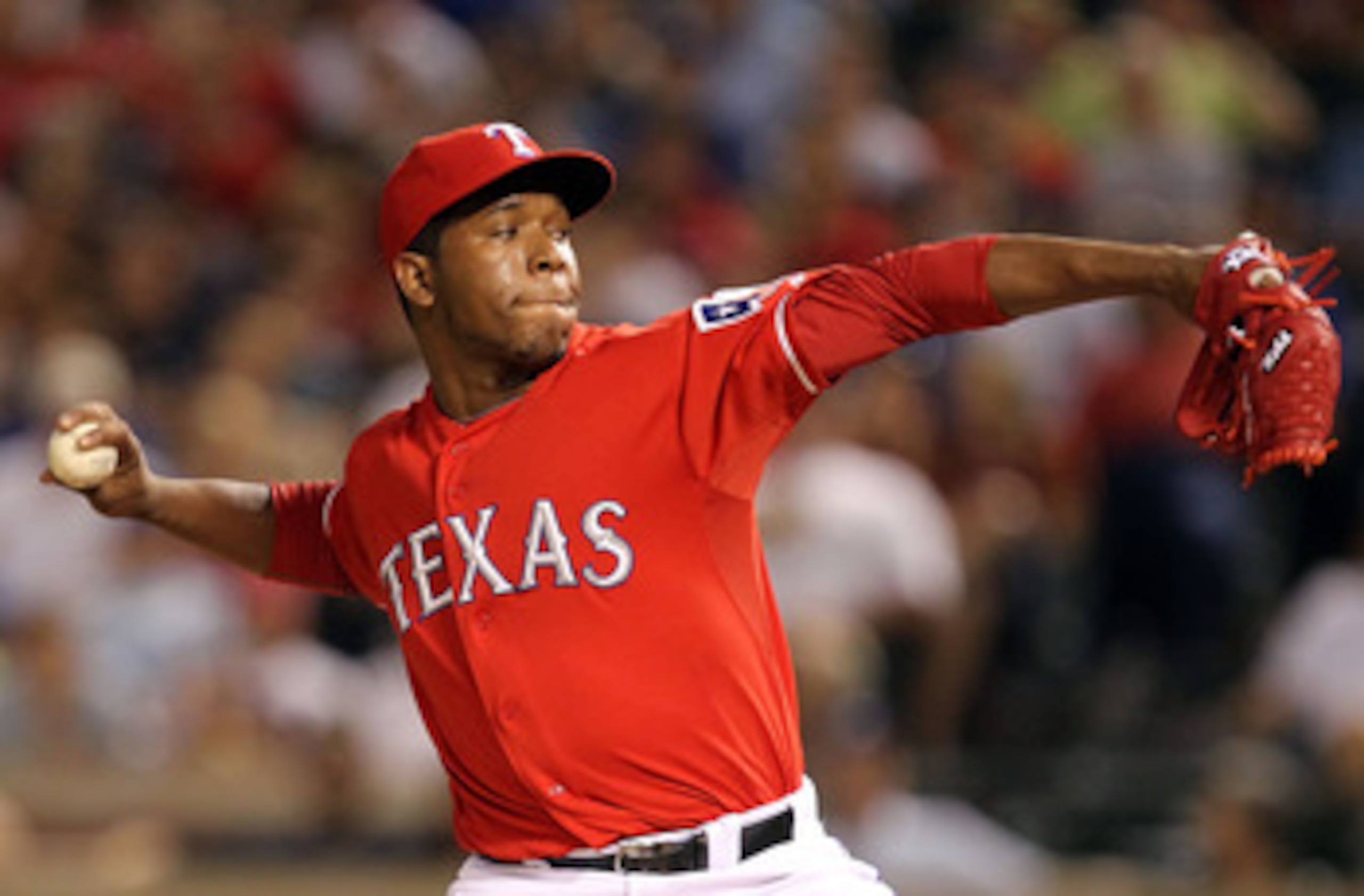 ARLINGTON, TX - MAY 07:  Pitcher Neftali Feliz #30 of the Texas Rangers throws against the New York Yankees at Rangers Ballpark in Arlington on May 7, 2011 in Arlington, Texas.  (Photo by Ronald Martinez/Getty Images)