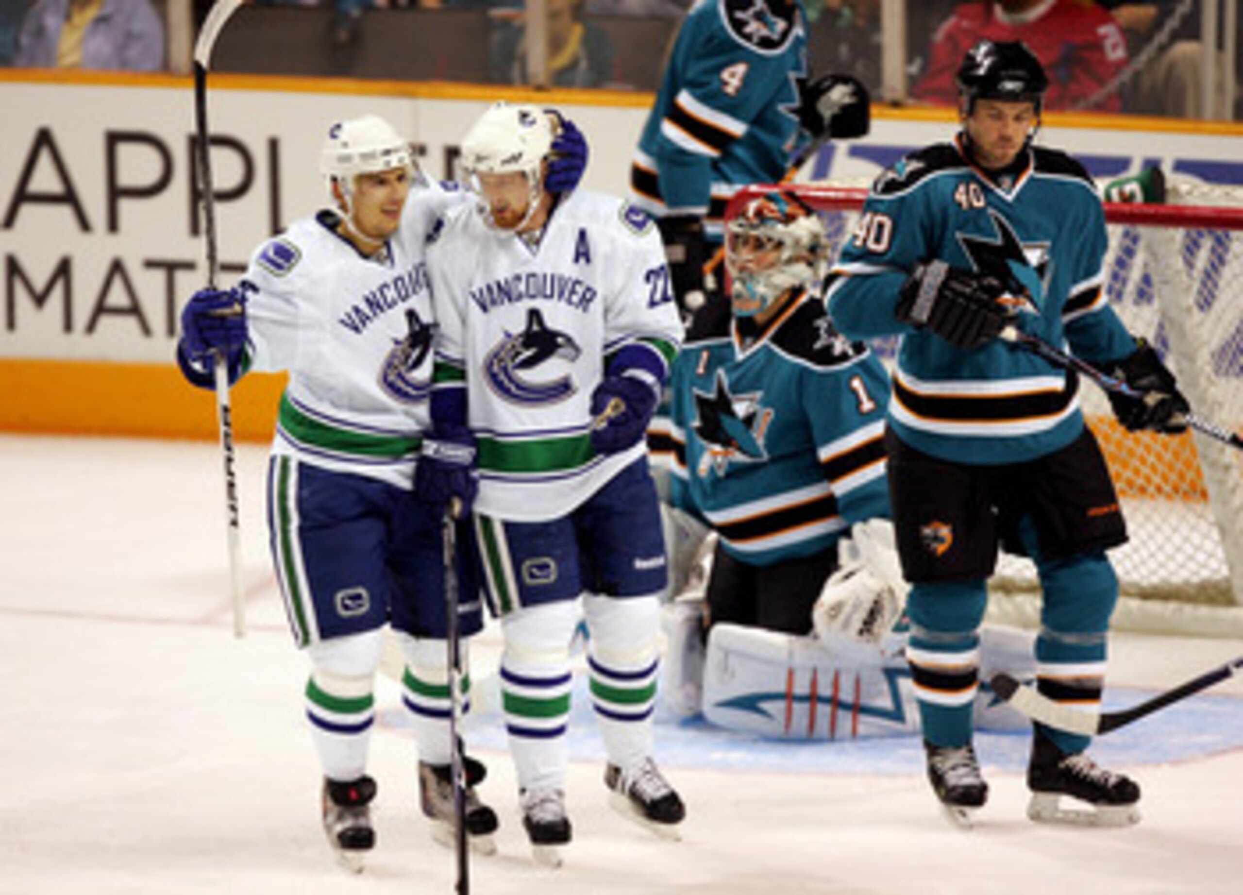 SAN JOSE, CA - SEPTEMBER 18:  Daniel Sedin #22 of the Vancouver Canucks is congratulated by teammate Sergei Shirokov #65 after he scored against the San Jose Sharks during their preseason game at HP Pavilion on September 18, 2009 in San Jose, California.