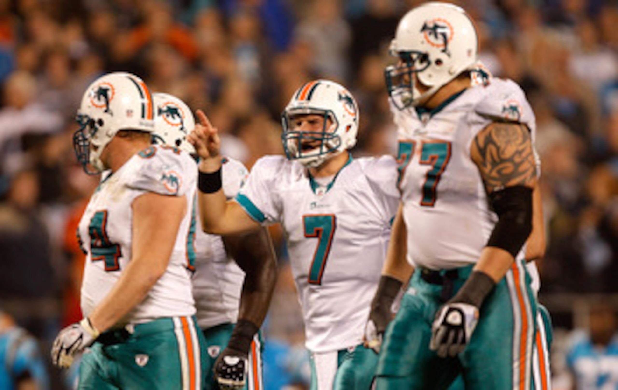 CHARLOTTE, NC - NOVEMBER 19:  Chad Henne #7 of the Miami Dolphins leads his team down the field against the Carolina Panthers during their game at Bank of America Stadium on November 19, 2009 in Charlotte, North Carolina.  (Photo by Streeter Lecka/Getty I