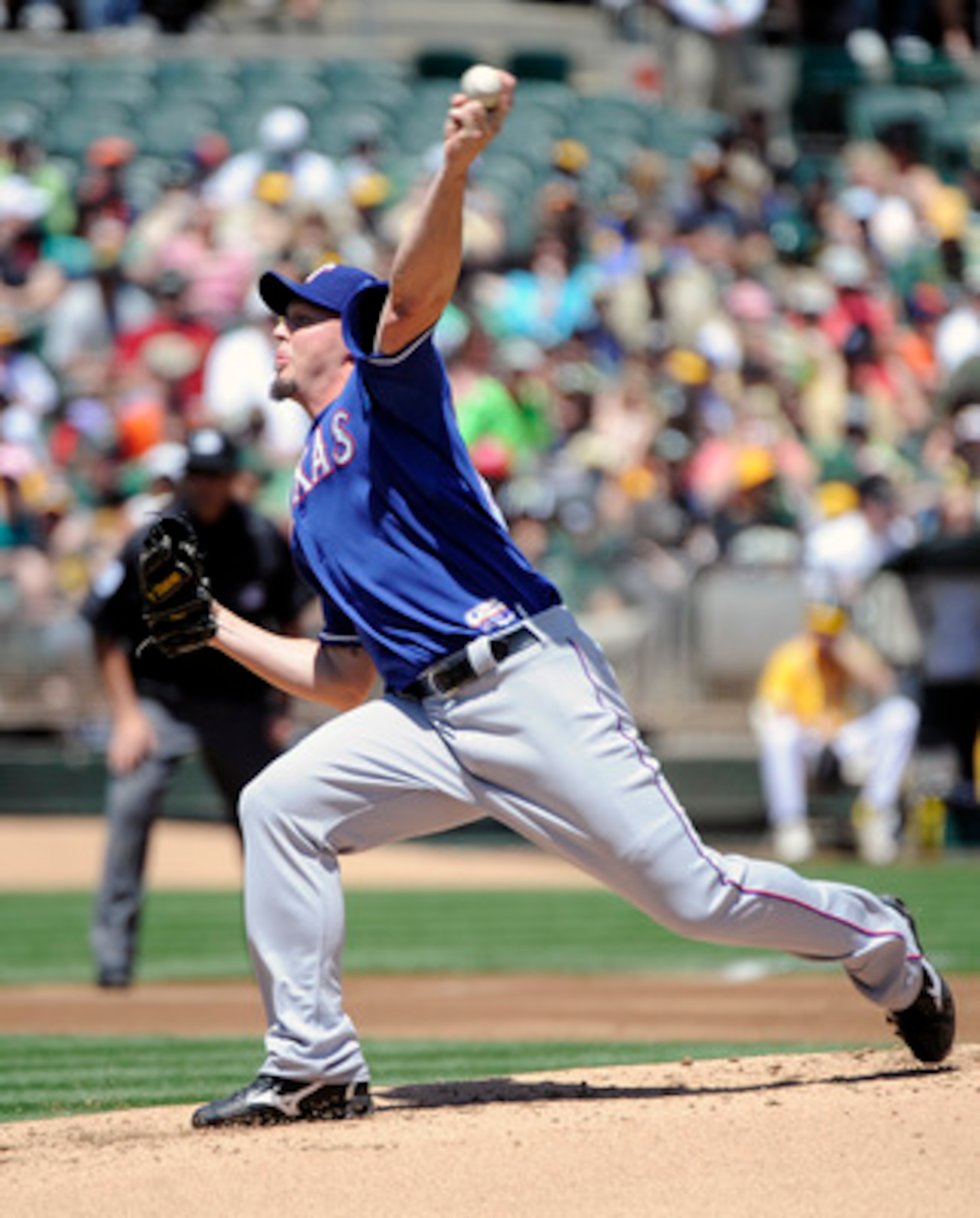 OAKLAND, CA - MAY 1: Matt Harrison #54 of the Texas Rangers pitches in the first inning against the Oakland Athletics during a MLB baseball game at the Oakland-Alameda County Coliseum May 1, 2011 in Oakland, California. (Photo by Thearon W. Henderson/Gett