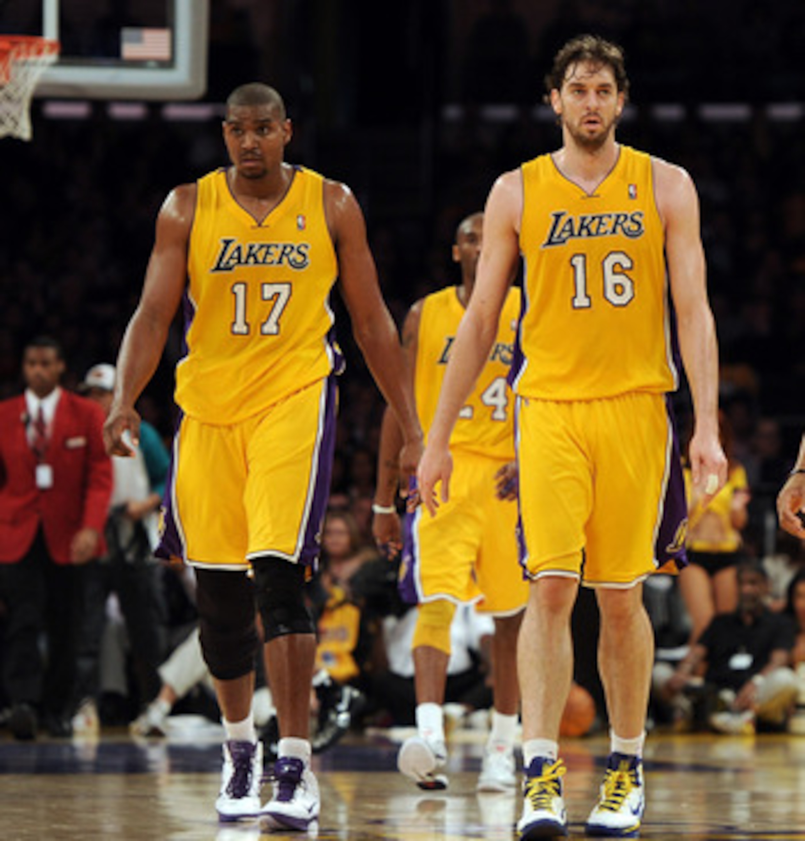 LOS ANGELES, CA - FEBRUARY 03: Pau Gasol #16, Derek Fisher #2 and Andrew Bynum #17 of the Los Angeles Lakers leave the court for a timeout trailing the San Antonio Spurs at Staples Center on February 3, 2011 in Los Angeles, California.  NOTE TO USER: User