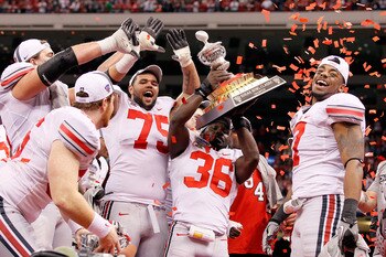 NEW ORLEANS, LA - JANUARY 04: Brian Rolle #36 of the Ohio State Buckeyes holds the trophy as the Buckeyes celebrate their 31-26 victory against the Arkansas Razorbacks during the Allstate Sugar Bowl at the Louisiana Superdome on January 4, 2011 in New Or NEW ORLEANS, LA - JANUARY 04: Brian Rolle #36 of the Ohio State Buckeyes holds the trophy as the Buckeyes celebrate their 31-26 victory against the Arkansas Razorbacks during the Allstate Sugar Bowl at the Louisiana Superdome on January 4, 2011 in New Or