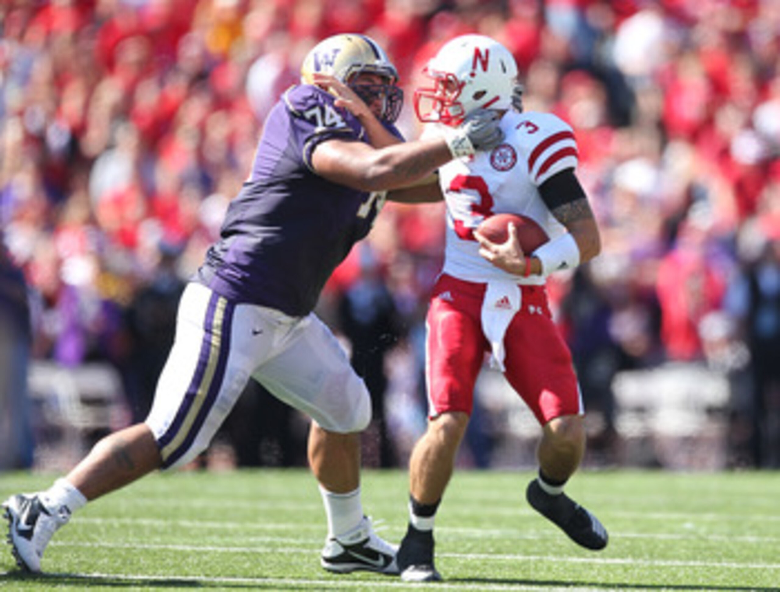 SEATTLE - SEPTEMBER 18: Quarterback Taylor Martinez #3 of the Nebraska Cornhuskers is tackled by Alameda Ta'amu #74 of the Washington Huskies on September 18, 2010 at Husky Stadium in Seattle, Washington. (Photo by Otto Greule Jr/Getty Images) SEATTLE - SEPTEMBER 18: Quarterback Taylor Martinez #3 of the Nebraska Cornhuskers is tackled by Alameda Ta'amu #74 of the Washington Huskies on September 18, 2010 at Husky Stadium in Seattle, Washington. (Photo by Otto Greule Jr/Getty Images)