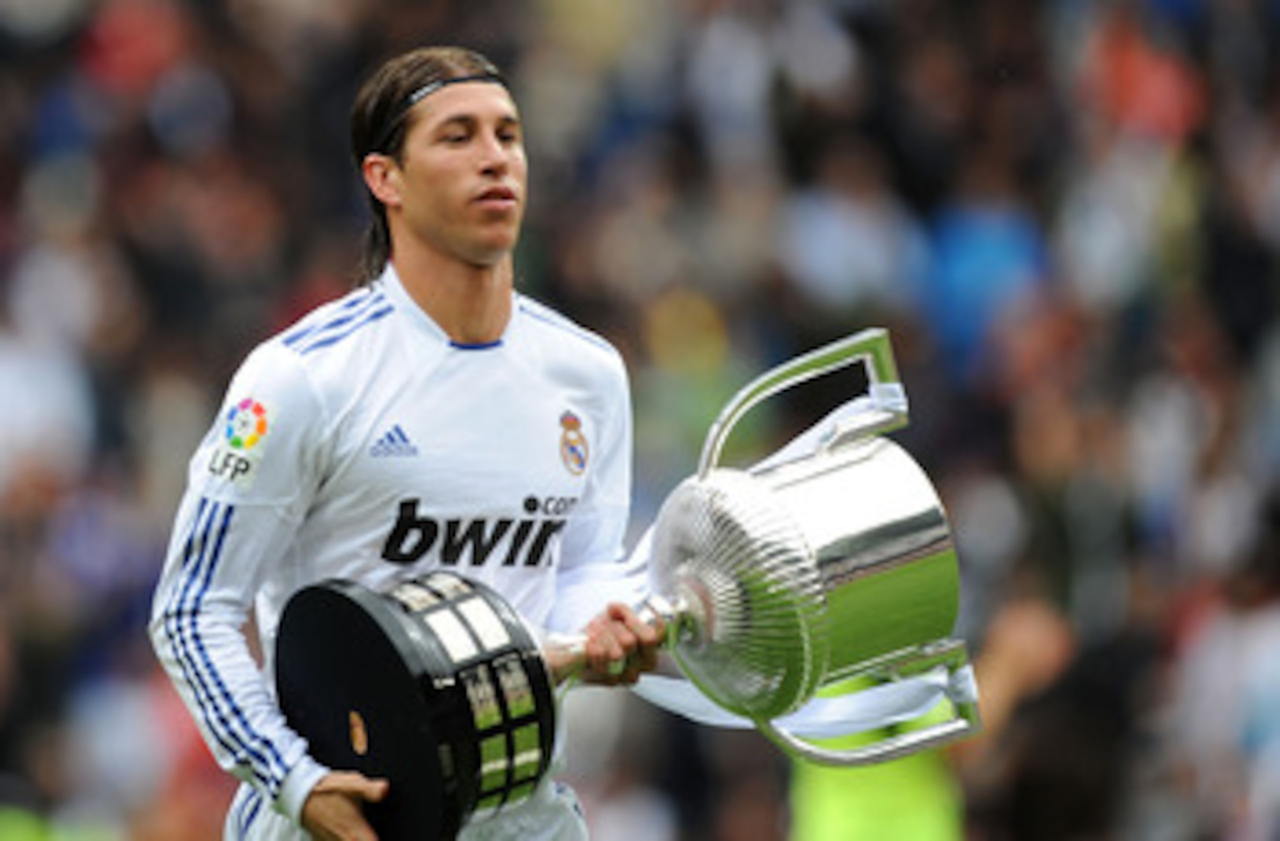 MADRID, SPAIN - APRIL 30: Sergio Ramos of Real Madrid walks away with the recently won Copa del Rey trophy before the La Liga match between Real Madrid and Real Zaragona at Estadio Santiago Bernabeu on April 30, 2011 in Madrid, Spain. (Photo by Denis Doy MADRID, SPAIN - APRIL 30: Sergio Ramos of Real Madrid walks away with the recently won Copa del Rey trophy before the La Liga match between Real Madrid and Real Zaragona at Estadio Santiago Bernabeu on April 30, 2011 in Madrid, Spain. (Photo by Denis Doy