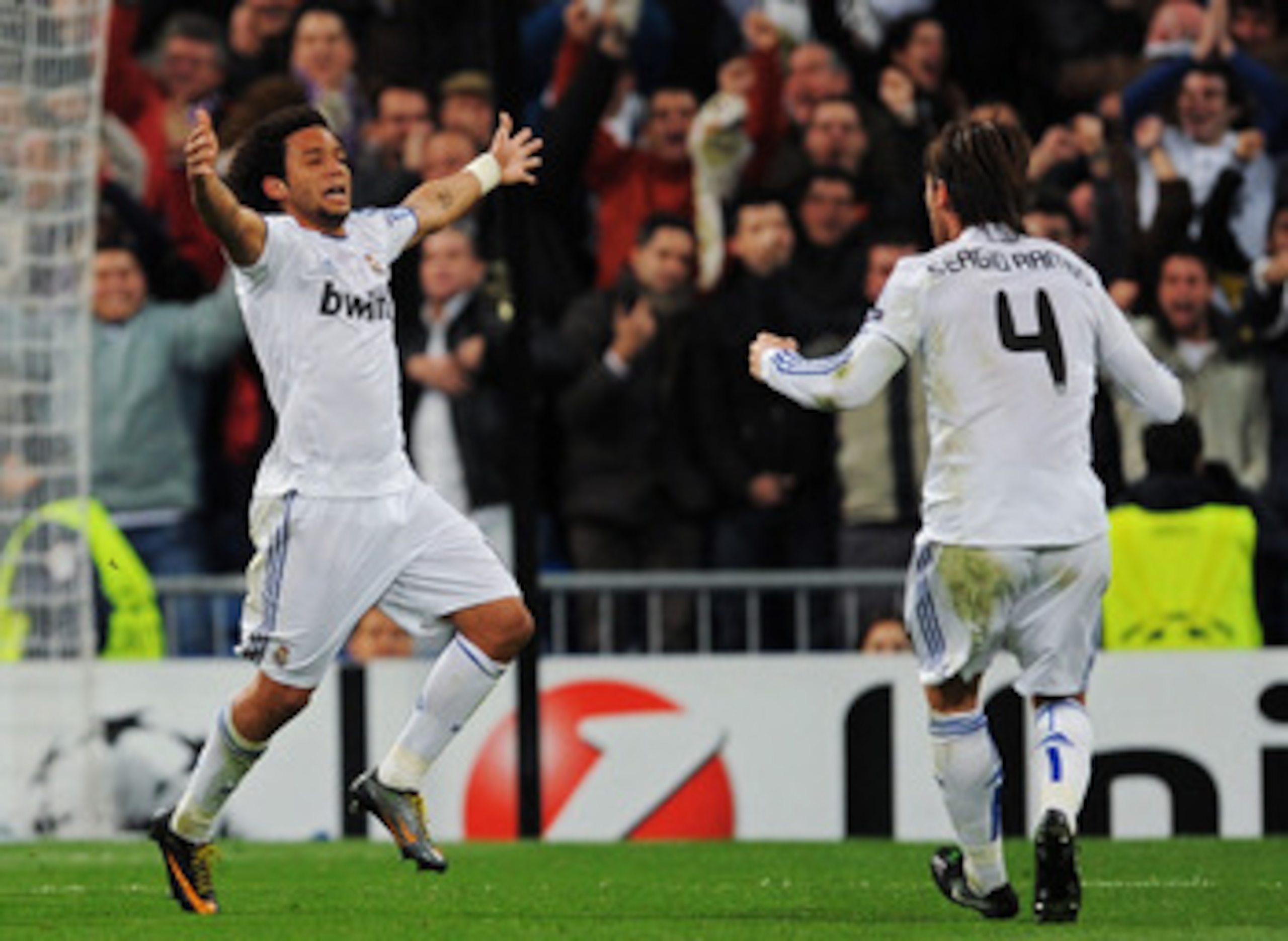 MADRID, SPAIN - MARCH 16: Marcelo Vieira of Real Madrid celebrates with Sergio Ramos after scoring Real's opening goal during the UEFA Champions League round of 16 second leg match between Real Madrid and Lyon at Estadio Santiago Bernabeu on March 16, 20 MADRID, SPAIN - MARCH 16: Marcelo Vieira of Real Madrid celebrates with Sergio Ramos after scoring Real's opening goal during the UEFA Champions League round of 16 second leg match between Real Madrid and Lyon at Estadio Santiago Bernabeu on March 16, 20