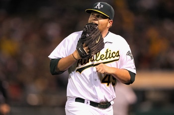OAKLAND, CA - APRIL 19:  Brett Anderson #49 of the Oakland Athletics runs off the field after the Oakland Athletics turned a double play to end the seventh inning of their game against the Boston Red Sox at Oakland-Alameda County Coliseum on April 19, 201