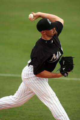 JUPITER, FL - MARCH 06: Pitcher Mike Dunn #40 of the Florida Marlins throws against the St. Louis Cardinals at Roger Dean Stadium on March 6, 2011 in Jupiter, Florida.  (Photo by Marc Serota/Getty Images)
