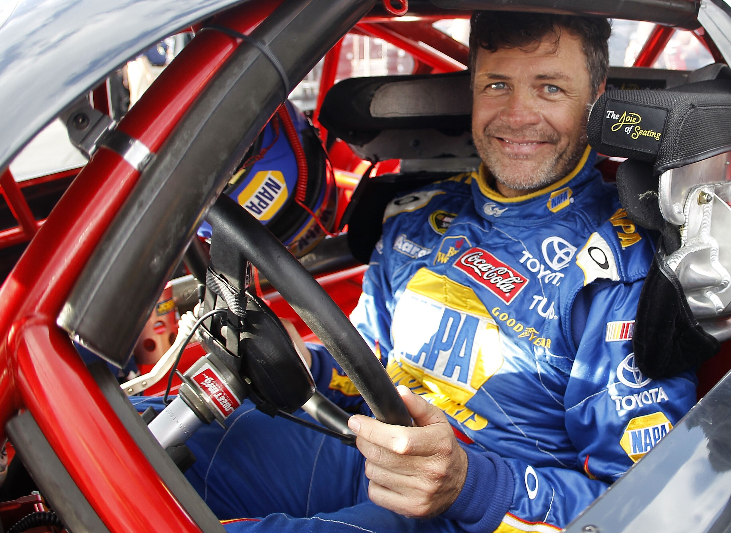 RICHMOND, VA - APRIL 28: Michael Waltrip, driver of the #15 Aaron's Toyota, prepares to drive during qualifying for the Denny Hamlin Short Track Showdown at Richmond International Raceway on April 28, 2011 in Richmond, Virginia. (Photo by Todd Warshaw/G RICHMOND, VA - APRIL 28: Michael Waltrip, driver of the #15 Aaron's Toyota, prepares to drive during qualifying for the Denny Hamlin Short Track Showdown at Richmond International Raceway on April 28, 2011 in Richmond, Virginia. (Photo by Todd Warshaw/G