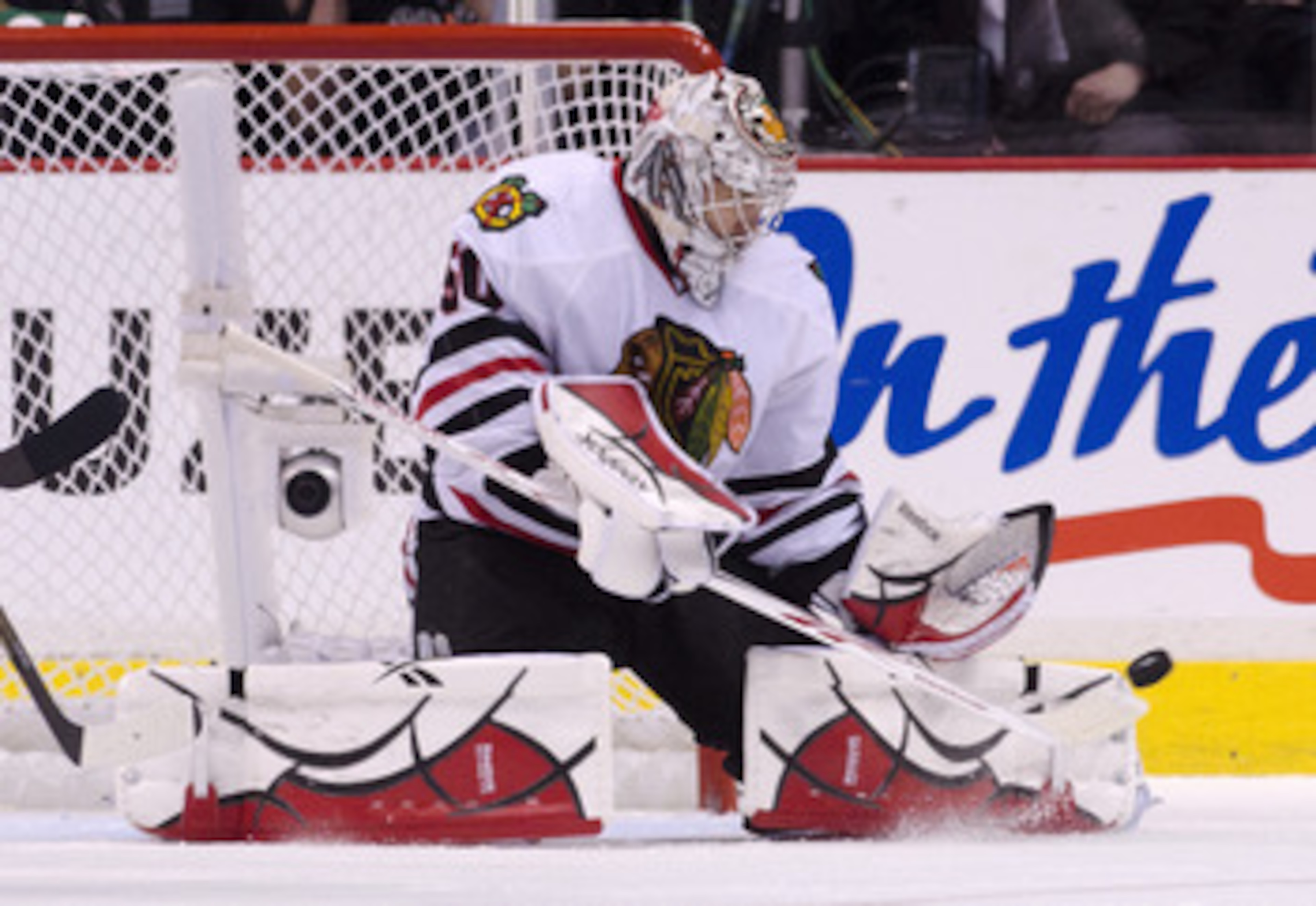 VANCOUVER, CANADA - APRIL 26: Goalie Corey Crawford #50 of the Chicago Blackhawks makes a pad save against the Vancouver Canucks during the second period in Game Seven of the Western Conference Quarterfinals during the 2011 NHL Stanley Cup Playoffs on Apr