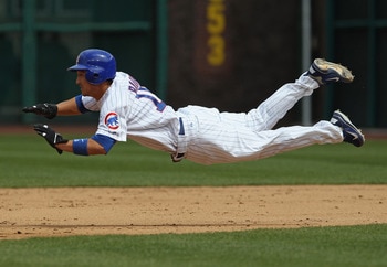CHICAGO, IL - MAY 06: Darwin Barney #15 of the Chicago Cubs dives into 2nd base for a steal against the Cincinnati Reds at Wrigley Field on May 6, 2011 in Chicago, Illinois. (Photo by Jonathan Daniel/Getty Images)