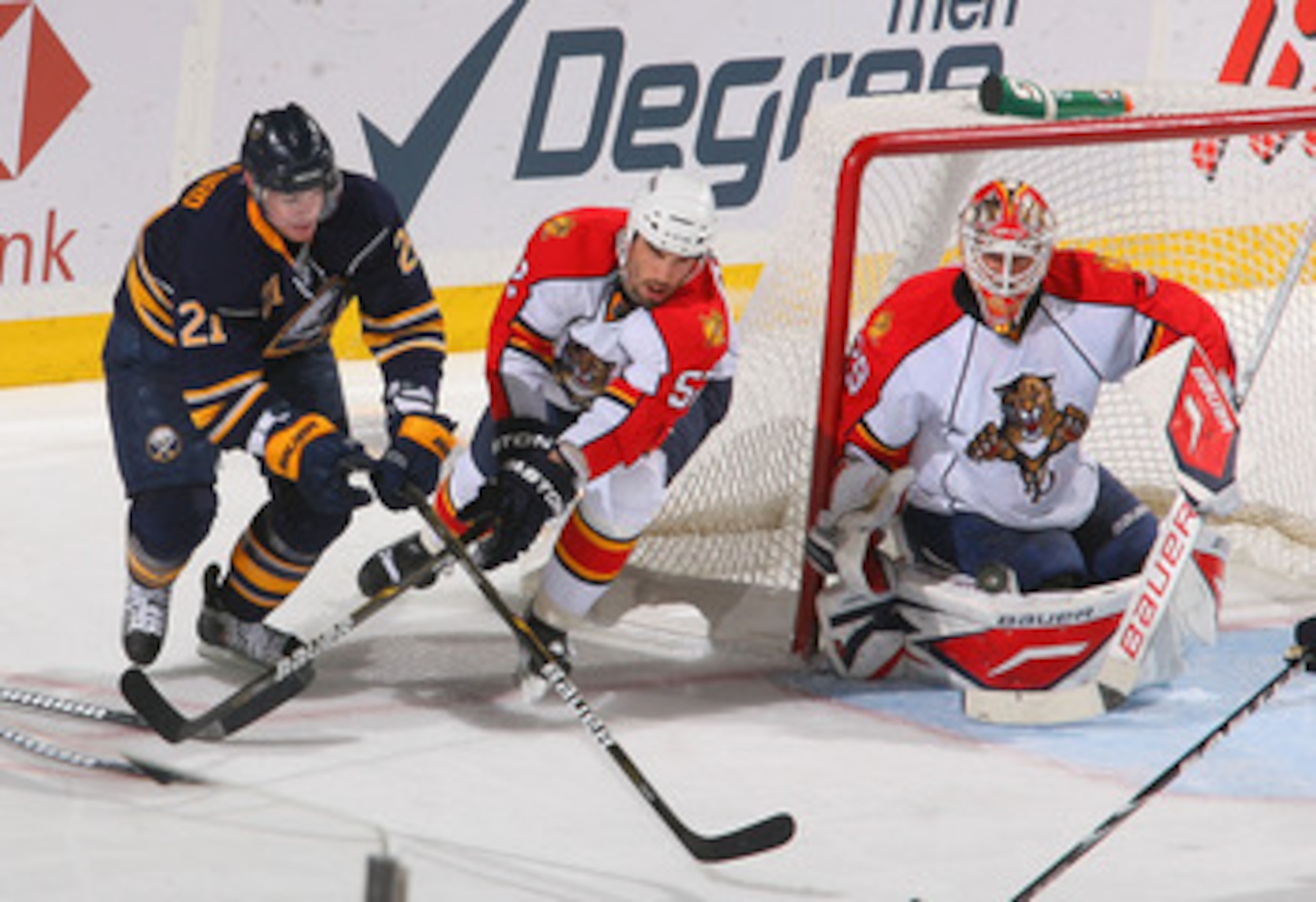 BUFFALO, NY - MARCH 25: Tomas Vokoun #29 and Jason Garrison #52 of the Florida Panthers defend against Drew Stafford #21 of the Buffalo Sabres at HSBC Arena on March 25, 2011 in Buffalo, New York.  (Photo by Rick Stewart/Getty Images)