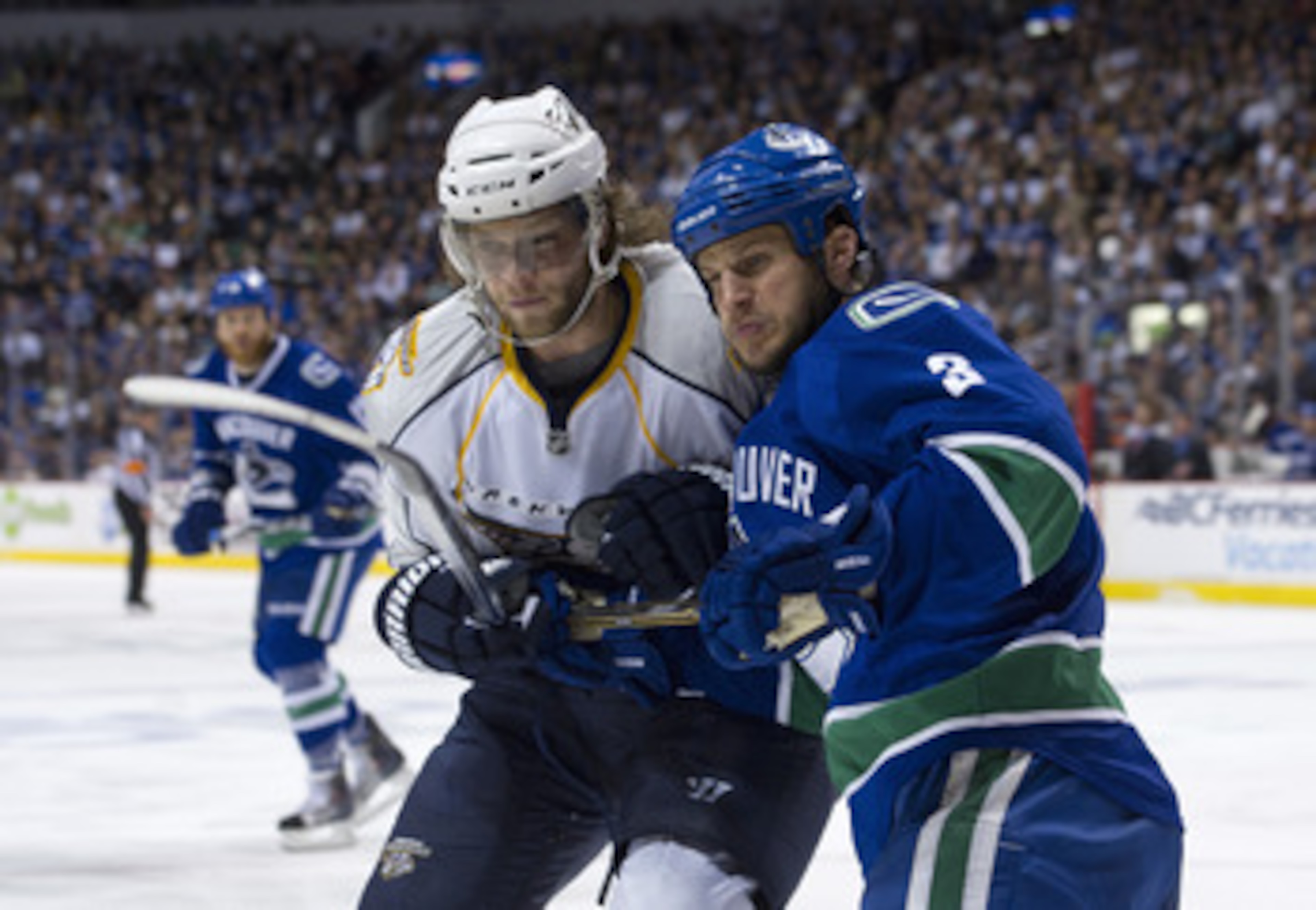 VANCOUVER, CANADA - MAY 7: Jonathon Blum #7 of the Nashville Predators holds Kevin Bieksa #3 of the Vancouver Canucks infront of the Vancouver goal during the first period in Game Five of the Western Conference Semifinals during the 2011 NHL Stanley Cup P