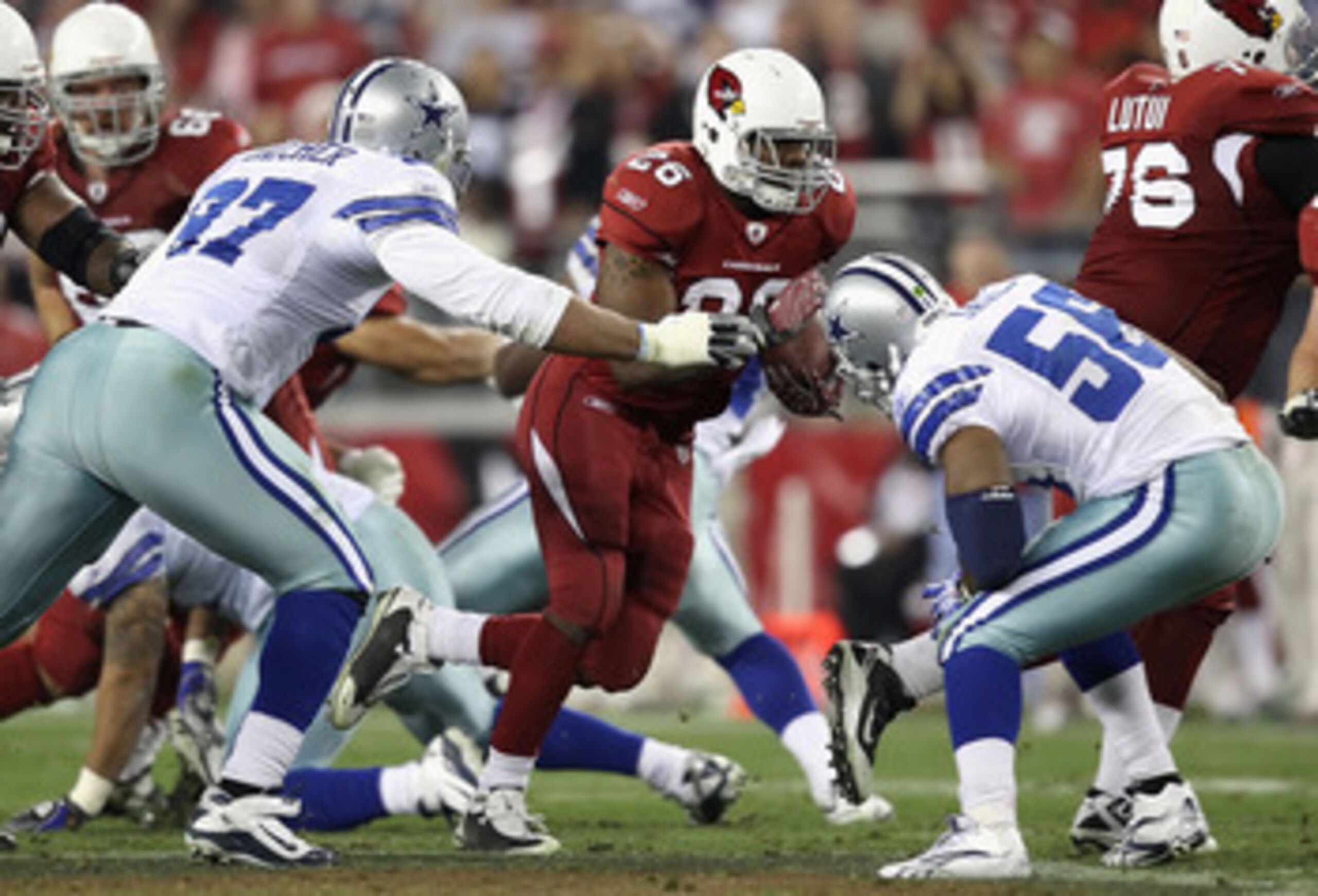 GLENDALE, AZ - DECEMBER 25:  Runningback Beanie Wells #26 of the Arizona Cardinals rushes the football against the Dallas Cowboys during the NFL game at the University of Phoenix Stadium on December 25, 2010 in Glendale, Arizona. The Cardinals defeated th