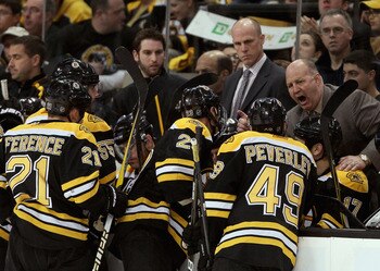 BOSTON, MA - APRIL 23:  Head coach Claude Julien of the Boston Bruins talks with his players during a time out against the Montreal Canadiens in Game Five of the Eastern Conference Quarterfinals during the 2011 NHL Stanley Cup Playoffs at TD Garden on Apr