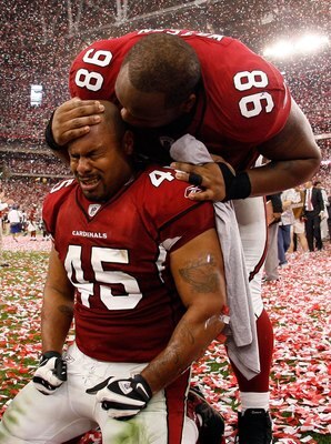 GLENDALE, AZ - JANUARY 18:  Fullback Terrelle Smith #45 and tackle Gabe Watson #98 of the Arizona Cardinals celebrate after the NFC championship game against the Philadelphia Eagles on January 18, 2009 at University of Phoenix Stadium in Glendale, Arizona