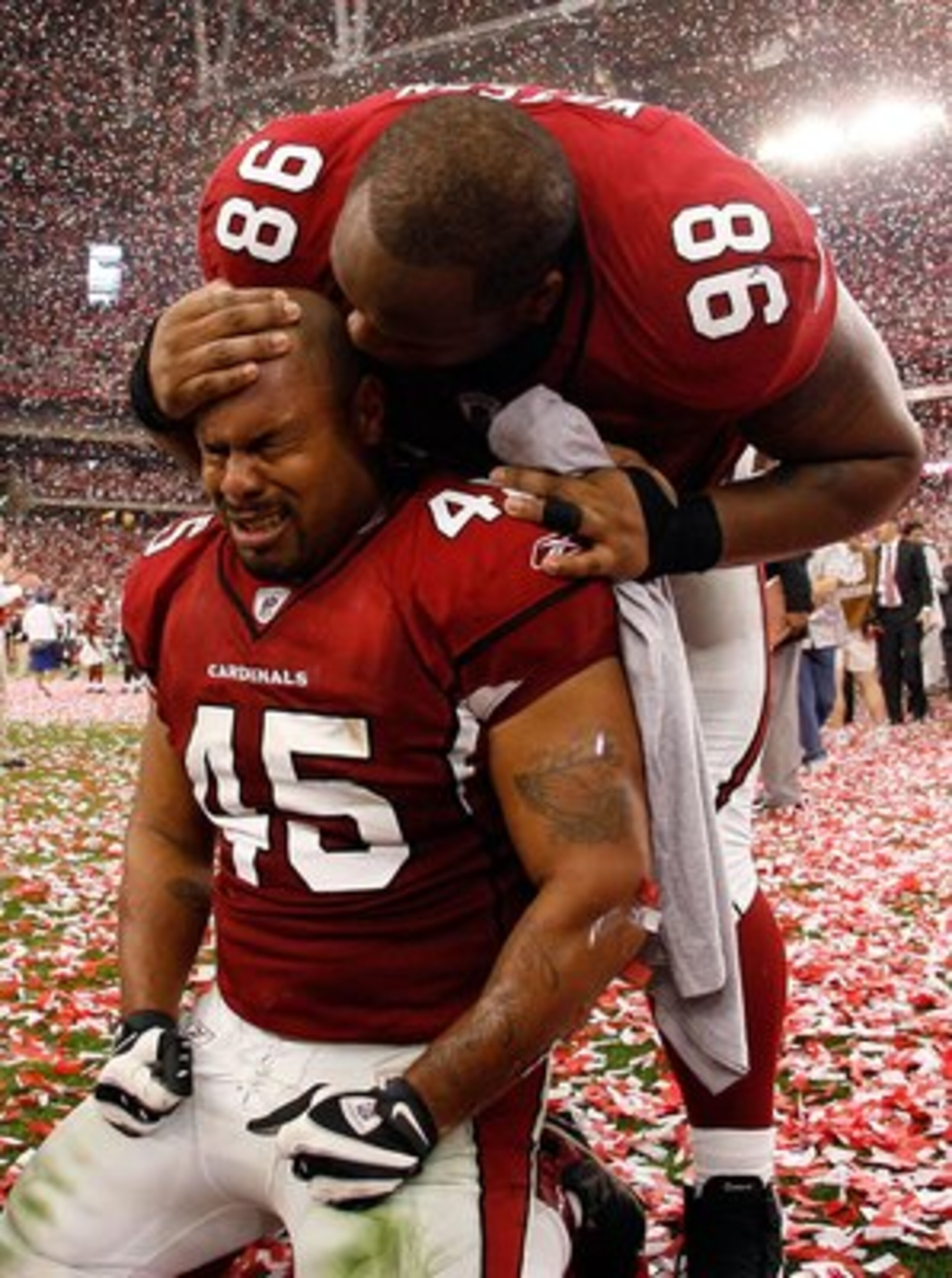 GLENDALE, AZ - JANUARY 18:  Fullback Terrelle Smith #45 and tackle Gabe Watson #98 of the Arizona Cardinals celebrate after the NFC championship game against the Philadelphia Eagles on January 18, 2009 at University of Phoenix Stadium in Glendale, Arizona