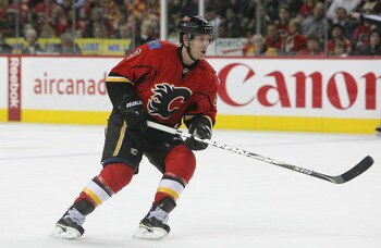 CALGARY,CANADA - FEBRUARY 22:  Brendan Morrison #8 of the Calgary Flames skates against the Boston Bruins during their NHL game at Scotiabank Saddledome, February 22,2011 in Calgary, Alberta, Canada.(Photo By Dave Sandford/Getty Images)