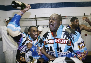 EAST RUTHERFORD, NJ - JUNE 12:  Kobe Bryant #8 and Shaquille O'Neal #34 of the Los Angeles Lakers celebrate defeating the New Jersey Nets in Game four of the 2002 NBA Finals on June 12, 2002 at Continental Airlines Arena in East Rutherford, New Jersey. Th