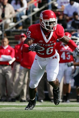 PISCATAWAY, NJ - OCTOBER 18:  Michael Smith #80 of the Connecticut Huskies runs the ball after a reception against Joe Lefeged #26 of the Rutgers Scarlet Knights at Rutgers Stadium on October 18, 2008 in Piscataway, New Jersey.  (Photo by Jim McIsaac/Gett