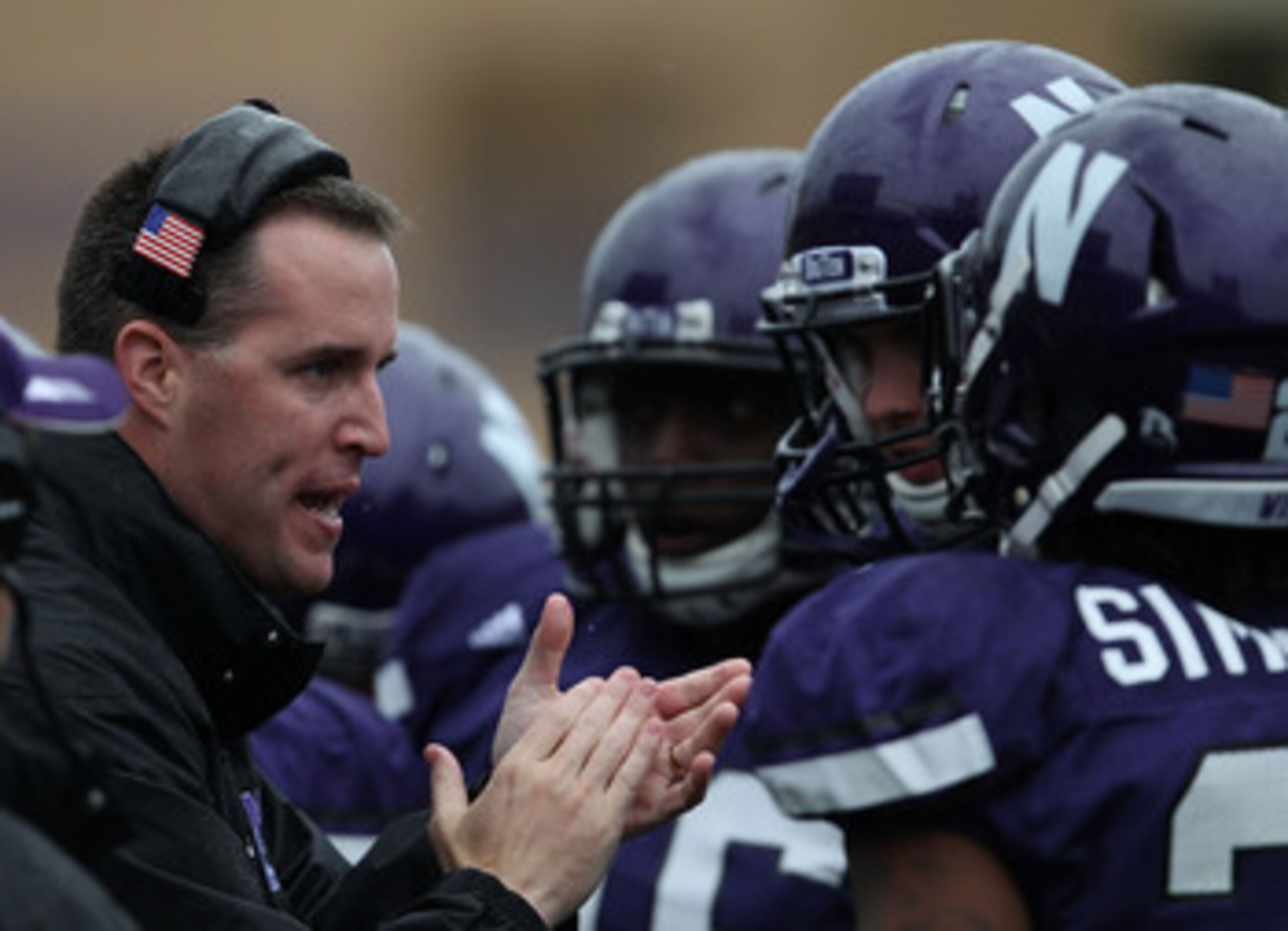 EVANSTON, IL - OCTOBER 23: Head coach Pat Fitzgerald of the Northwestern Wildcats encourages his team as they take on the Michigan State Spartans at Ryan Field on October 23, 2010 in Evanston, Illinois. Michigan State defeated Northwestern 35-27. (Photo b