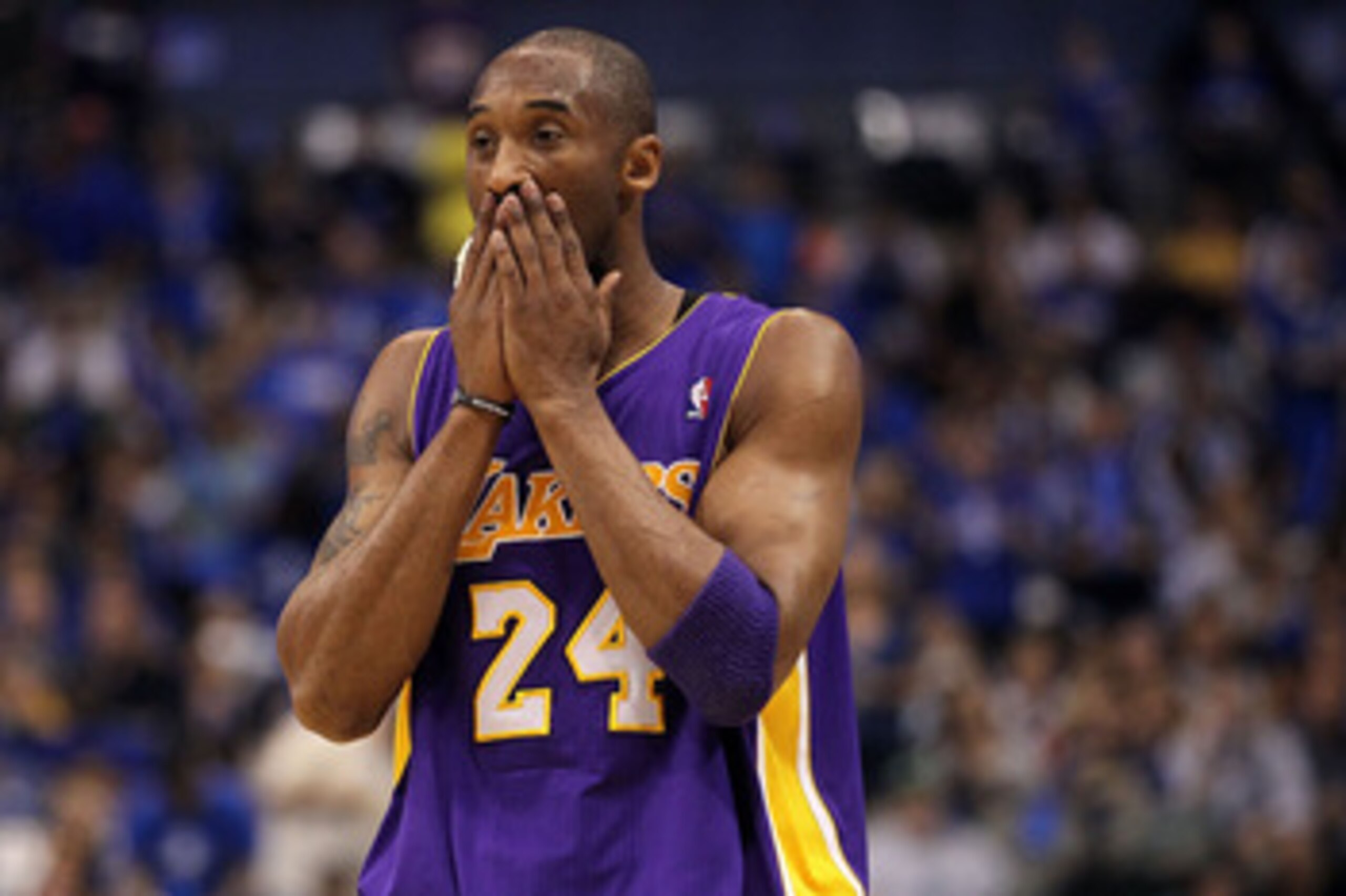 DALLAS, TX - MAY 08:  Guard Kobe Bryant #24 of the Los Angeles Lakers wipes his face during play against the Dallas Mavericks in Game Four of the Western Conference Semifinals during the 2011 NBA Playoffs on May 8, 2011 at American Airlines Center in Dall
