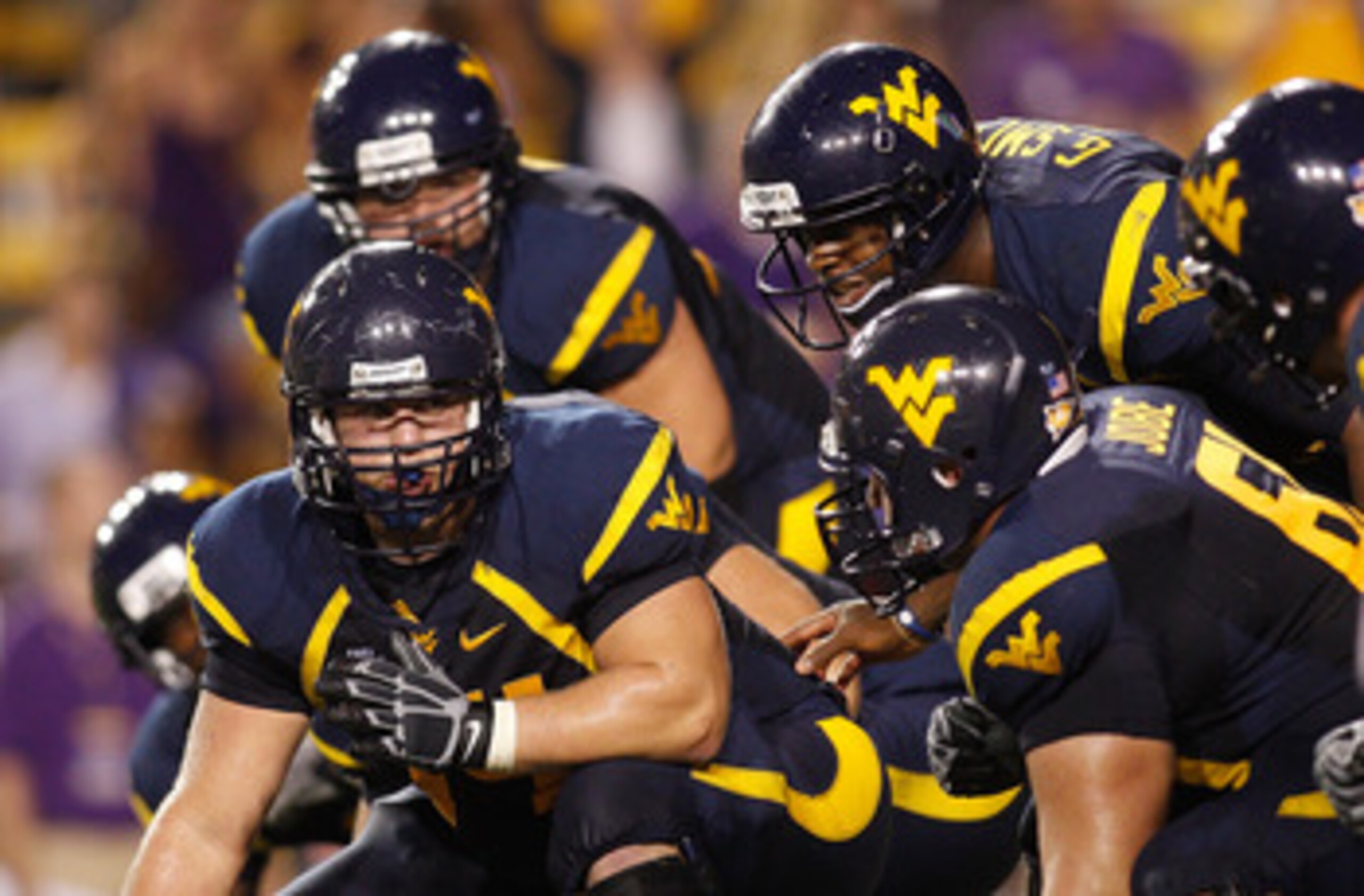 BATON ROUGE, LA - SEPTEMBER 25:  Quarterback Geno Smith #12 of the West Virginia Mountaineers in action against the Louisiana State University Tigers at Tiger Stadium on September 25, 2010 in Baton Rouge, Louisiana.  (Photo by Chris Graythen/Getty Images)