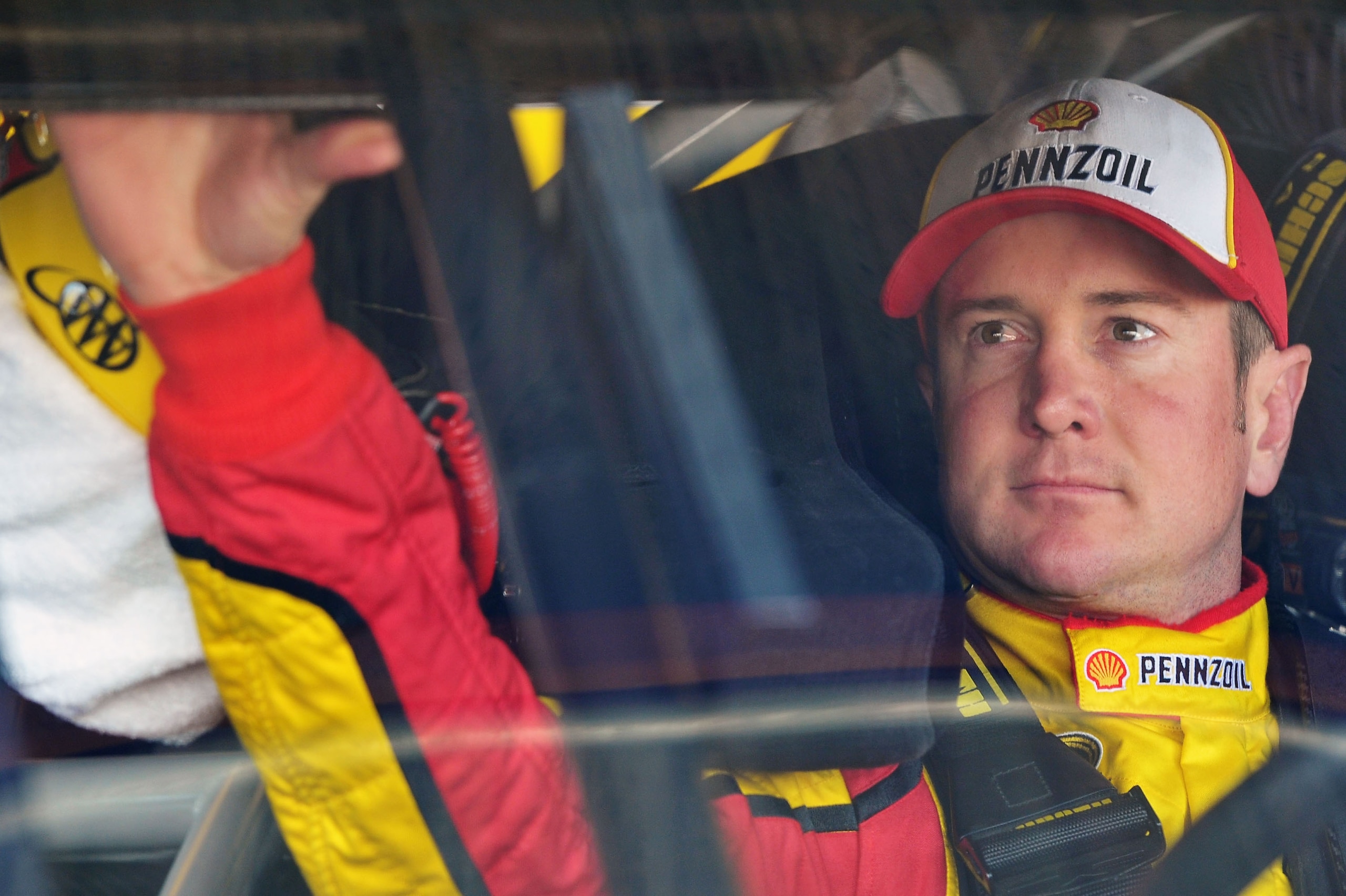 RICHMOND, VA - APRIL 29: Kurt Busch, driver of the #22 Shell/Pennzoil Dodge, sits in his car during practice for the NASCAR Sprint Cup Series Crown Royal Presents The Matthew & Daniel Hansen 400 at Richmond International Raceway on April 29, 2011 in Rich RICHMOND, VA - APRIL 29: Kurt Busch, driver of the #22 Shell/Pennzoil Dodge, sits in his car during practice for the NASCAR Sprint Cup Series Crown Royal Presents The Matthew & Daniel Hansen 400 at Richmond International Raceway on April 29, 2011 in Rich