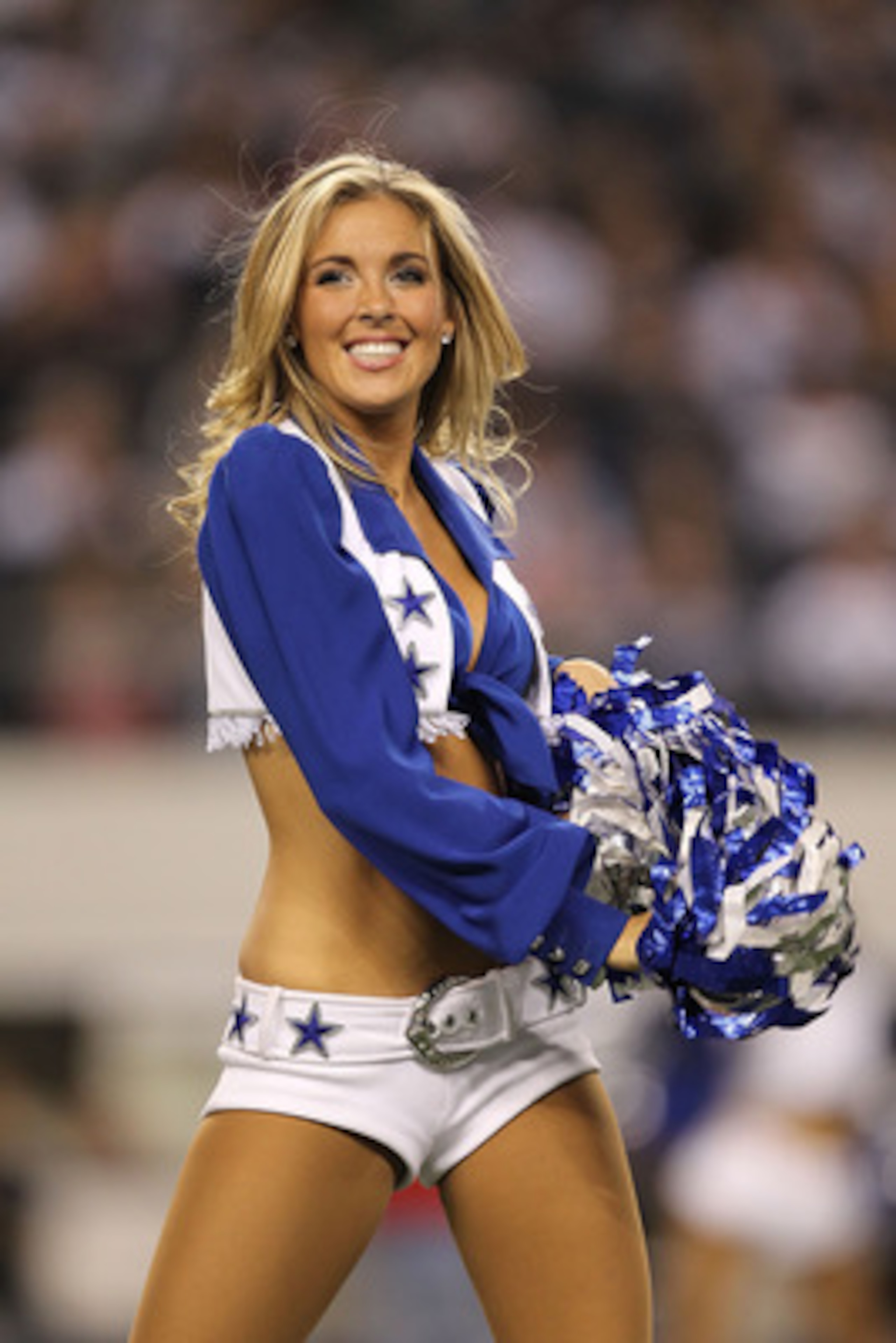 ARLINGTON, TX - DECEMBER 12:  A Dallas Cowboys cheerleader performs at Cowboys Stadium on December 12, 2010 in Arlington, Texas.  (Photo by Ronald Martinez/Getty Images)