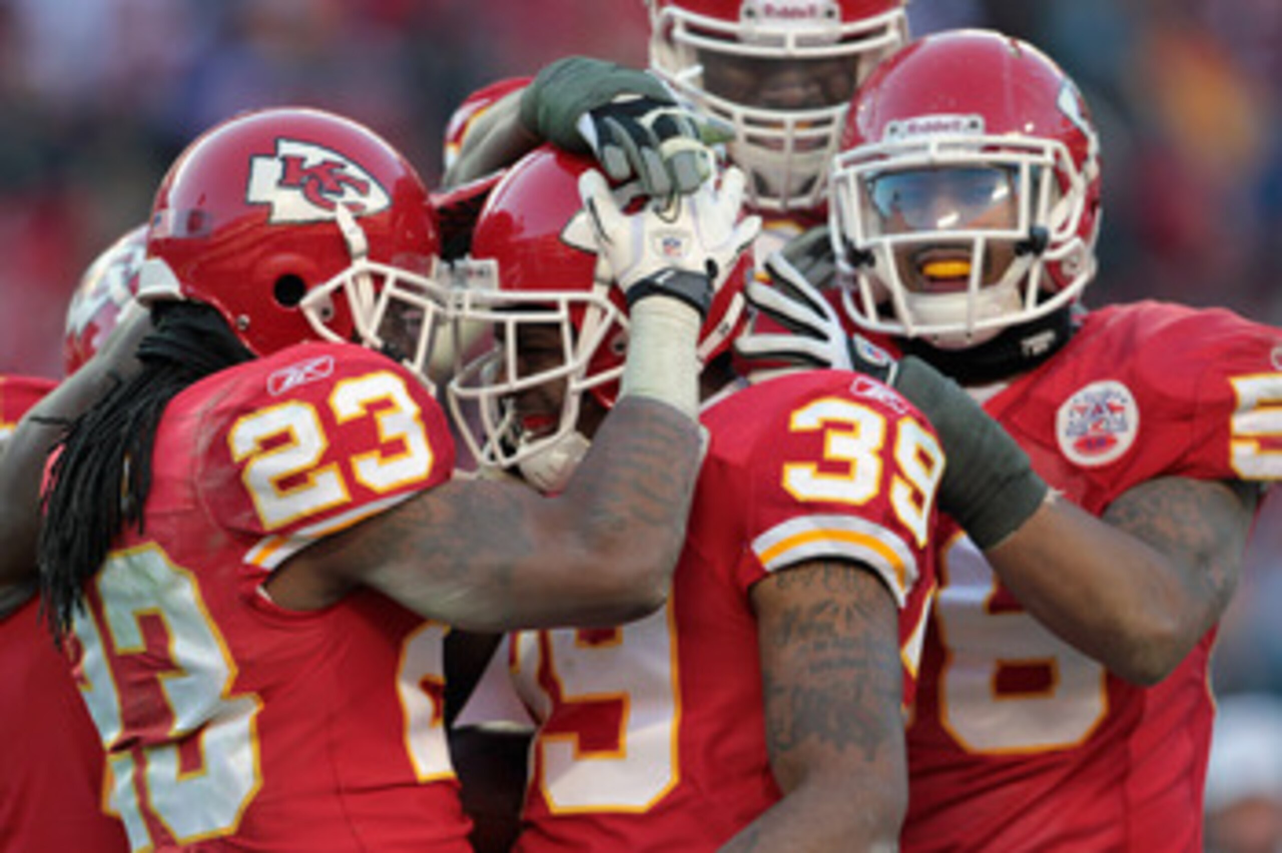 KANSAS CITY, MO - DECEMBER 26:  Brandon Carr #39 of the Kansas City Chiefs is congratulated by Kendrick Lewis #23 and teammates after an interception during the game against the Tennessee Titans on December 26, 2010 at Arrowhead Stadium in Kansas City, Mi