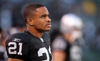 OAKLAND, CA - NOVEMBER 28:  Nnamdi Asomugha #21 of the Oakland Raiders stands on the sidelines during the closing minutes of their loss to the Miami Dolphins at Oakland-Alameda County Coliseum on November 28, 2010 in Oakland, California.  (Photo by Ezra S