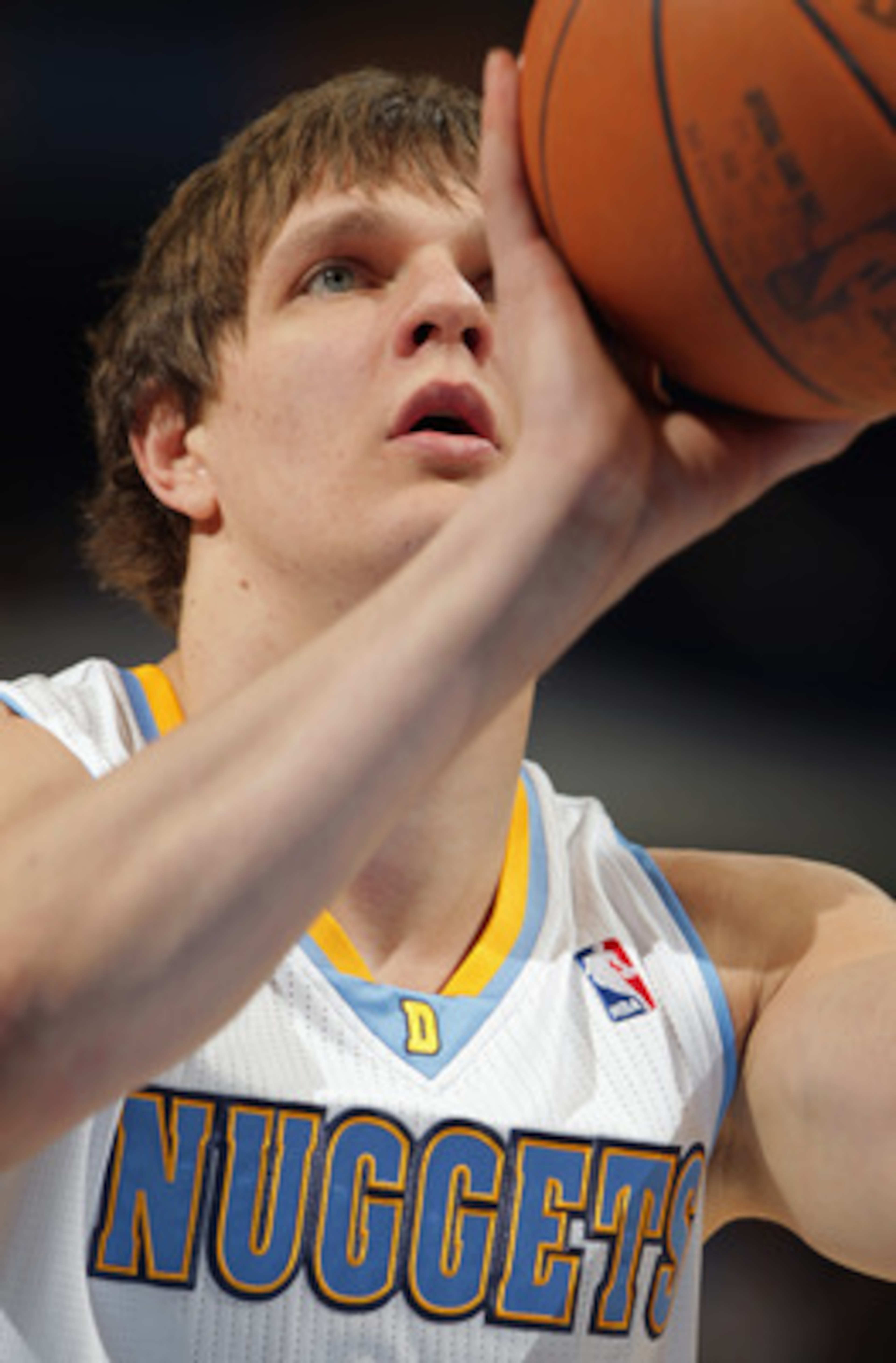 DENVER, CO - MARCH 21:  Timofey Mozgov #25 of the Denver Nuggets takes a free throw against the Toronto Raptors at the Pepsi Center on March 21, 2011 in Denver, Colorado. The Nuggets defeated the Raptors 123-90. NOTE TO USER: User expressly acknowledges a