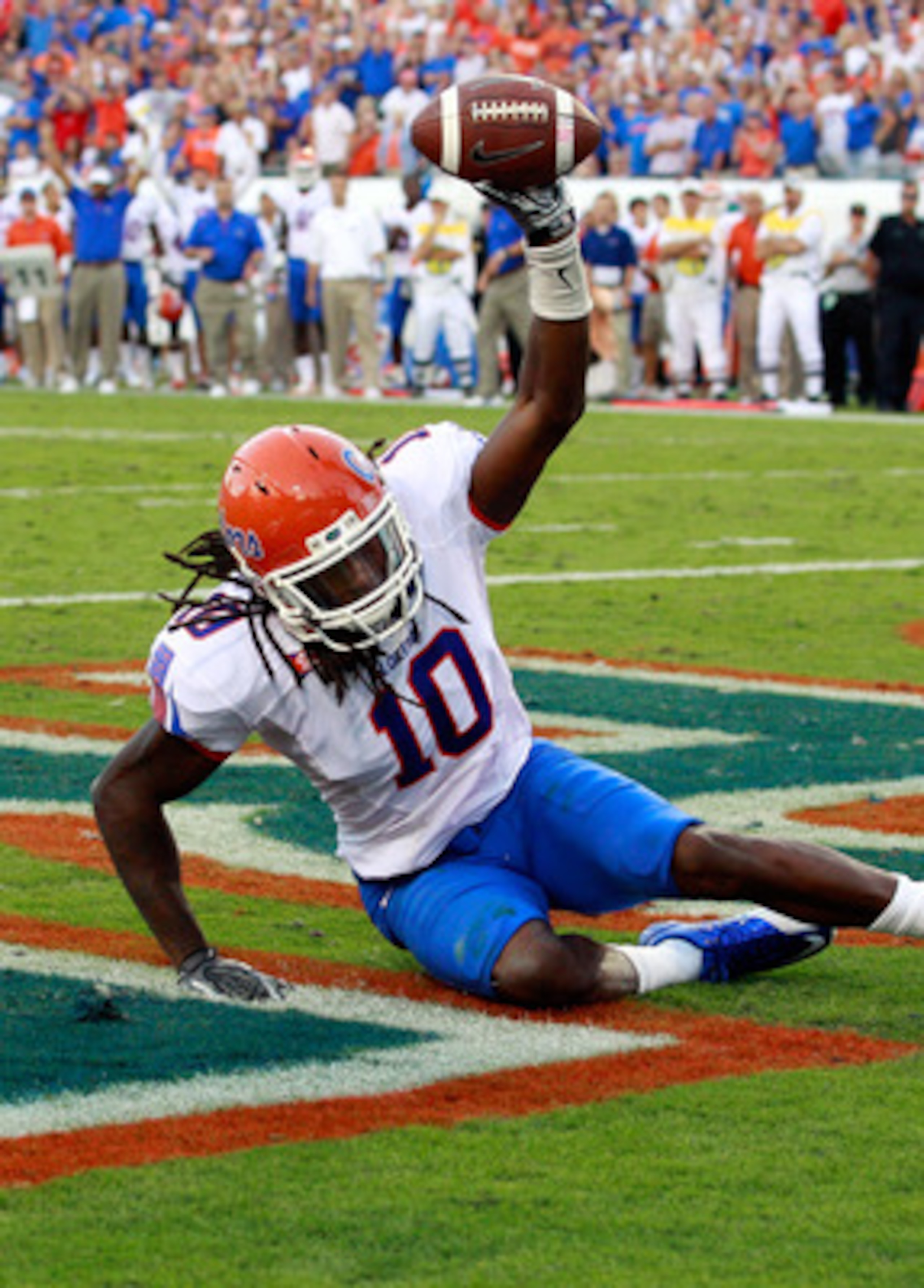 JACKSONVILLE, FL - OCTOBER 30:  Will Hill #10 of the Florida Gators holds up the ball after an interception during the game against the Georgia Bulldogs at EverBank Field on October 30, 2010 in Jacksonville, Florida.  (Photo by Sam Greenwood/Getty Images)