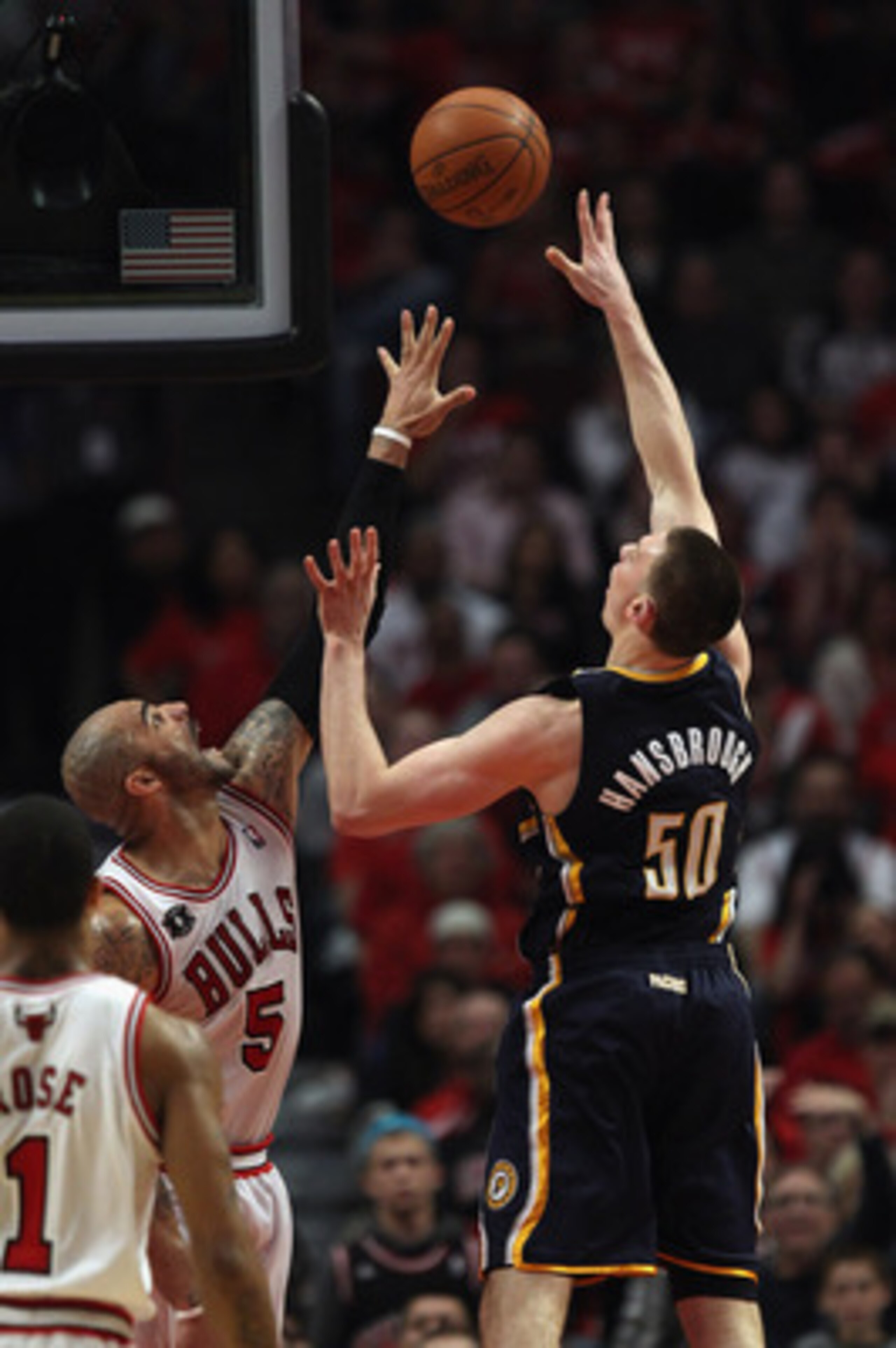 CHICAGO, IL - APRIL 16: Tyler Hansbrough #50 of the Indiana Pacers puts up a shot over Carlos Boozer #5 of the Chicago Bulls in Game One of the Eastern Conference Quarterfinals in the 2011 NBA Playoffs at the United Center on April 16, 2011 in Chicago, Il CHICAGO, IL - APRIL 16: Tyler Hansbrough #50 of the Indiana Pacers puts up a shot over Carlos Boozer #5 of the Chicago Bulls in Game One of the Eastern Conference Quarterfinals in the 2011 NBA Playoffs at the United Center on April 16, 2011 in Chicago, Il
