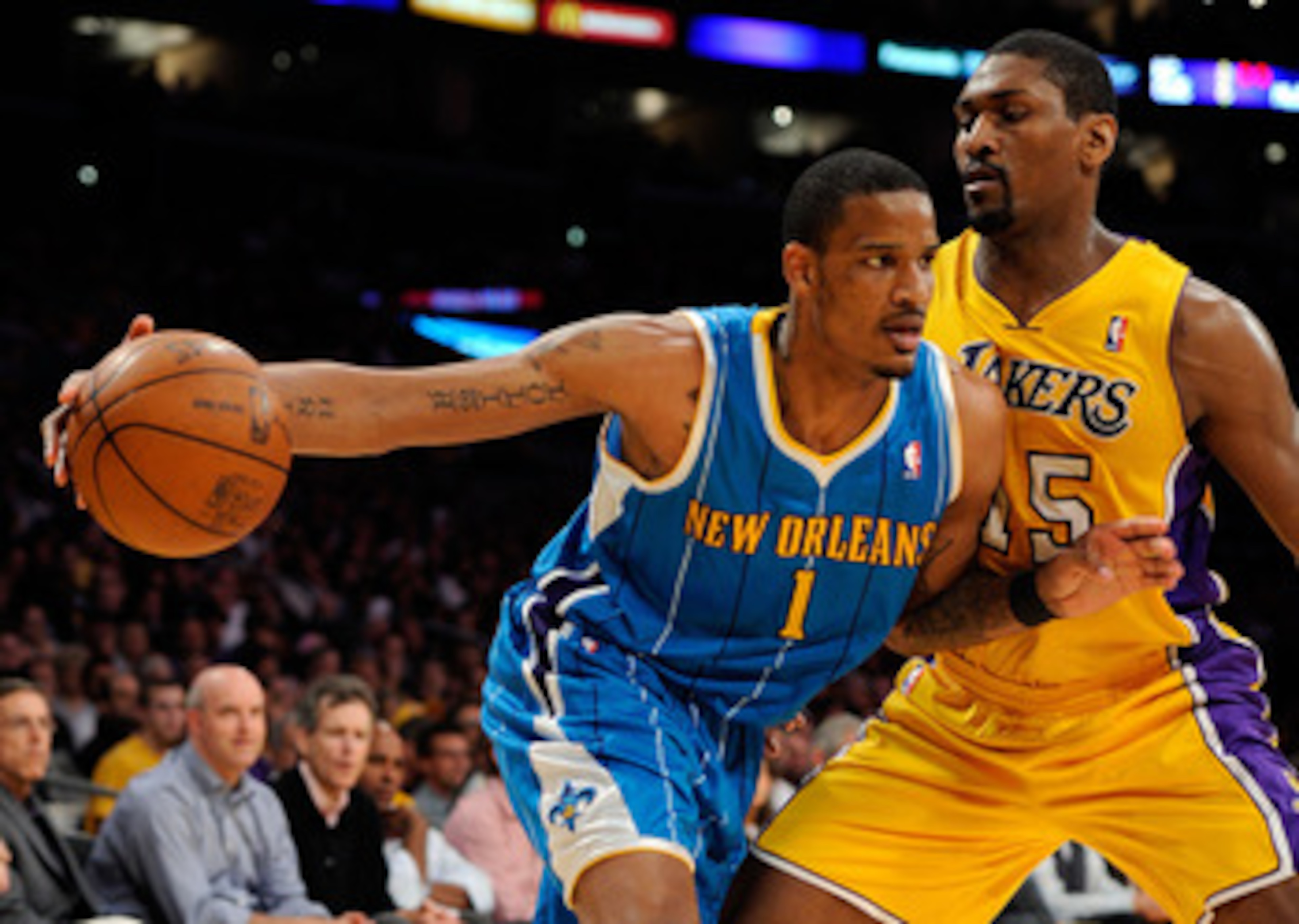 LOS ANGELES, CA - APRIL 20:  Trevor Ariza #1 of the New Orleans Hornets drives on Ron Artest #15 of the Los Angeles Lakers in the first quarter in Game Two of the Western Conference Quarterfinals in the 2011 NBA Playoffs on April 20, 2011 at Staples Cente