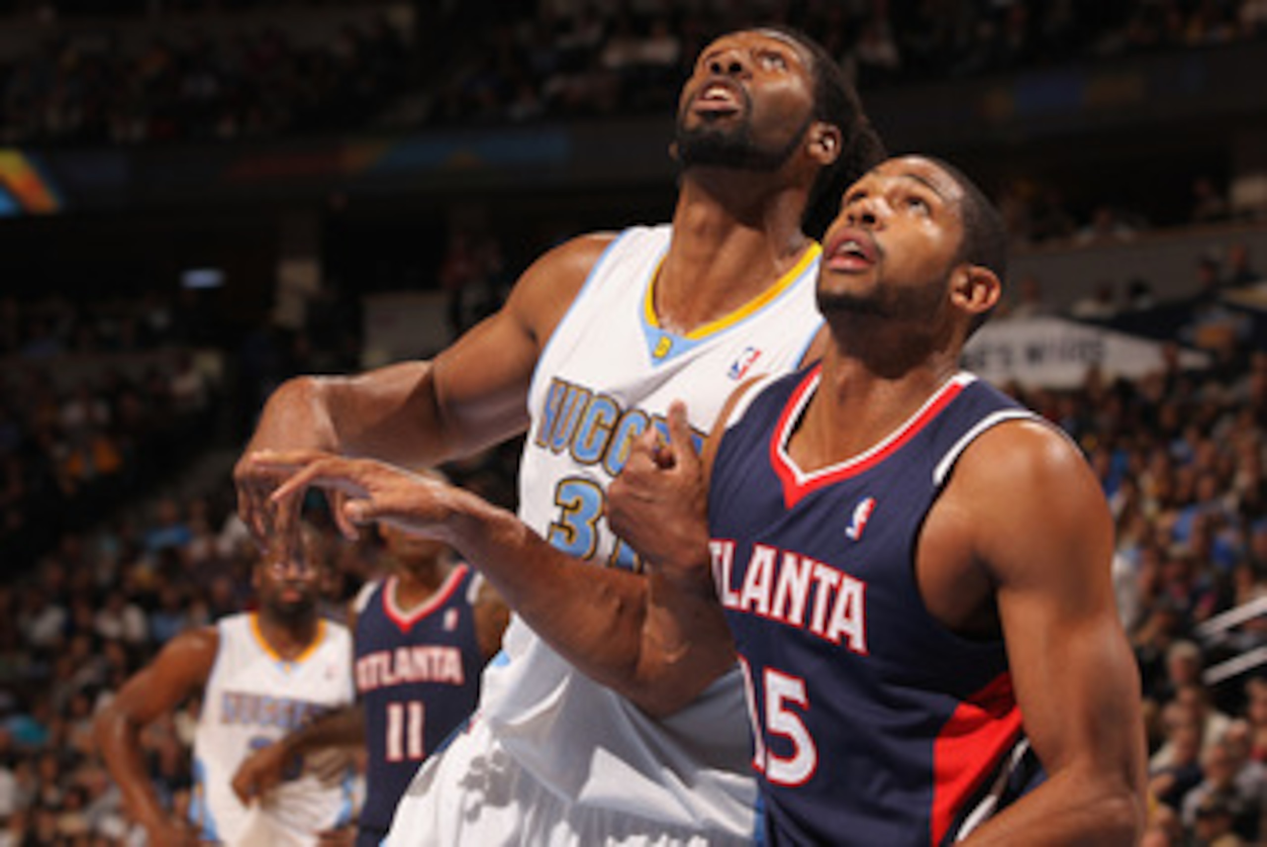 DENVER, CO - FEBRUARY 28:  Nene #31 of the Denver Nuggets battles for position with Al Horford #15 of the Atlanta Hawks during NBA action at the Pepsi Center on February 28, 2011 in Denver, Colorado. The Nuggets deafeated the Hawks 100-90. NOTE TO USER: U