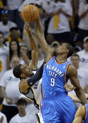 MEMPHIS, TN - MAY 07:  Serge Ibaka #9 of the Oklahoma City Thunder blocks the shot of Mike Conley #11 of the Memphis Grizzlies in Game Three of the Western Conference Semifinals in the 2011 NBA Playoffs at FedExForum on May 7, 2011 in Memphis, Tennessee.