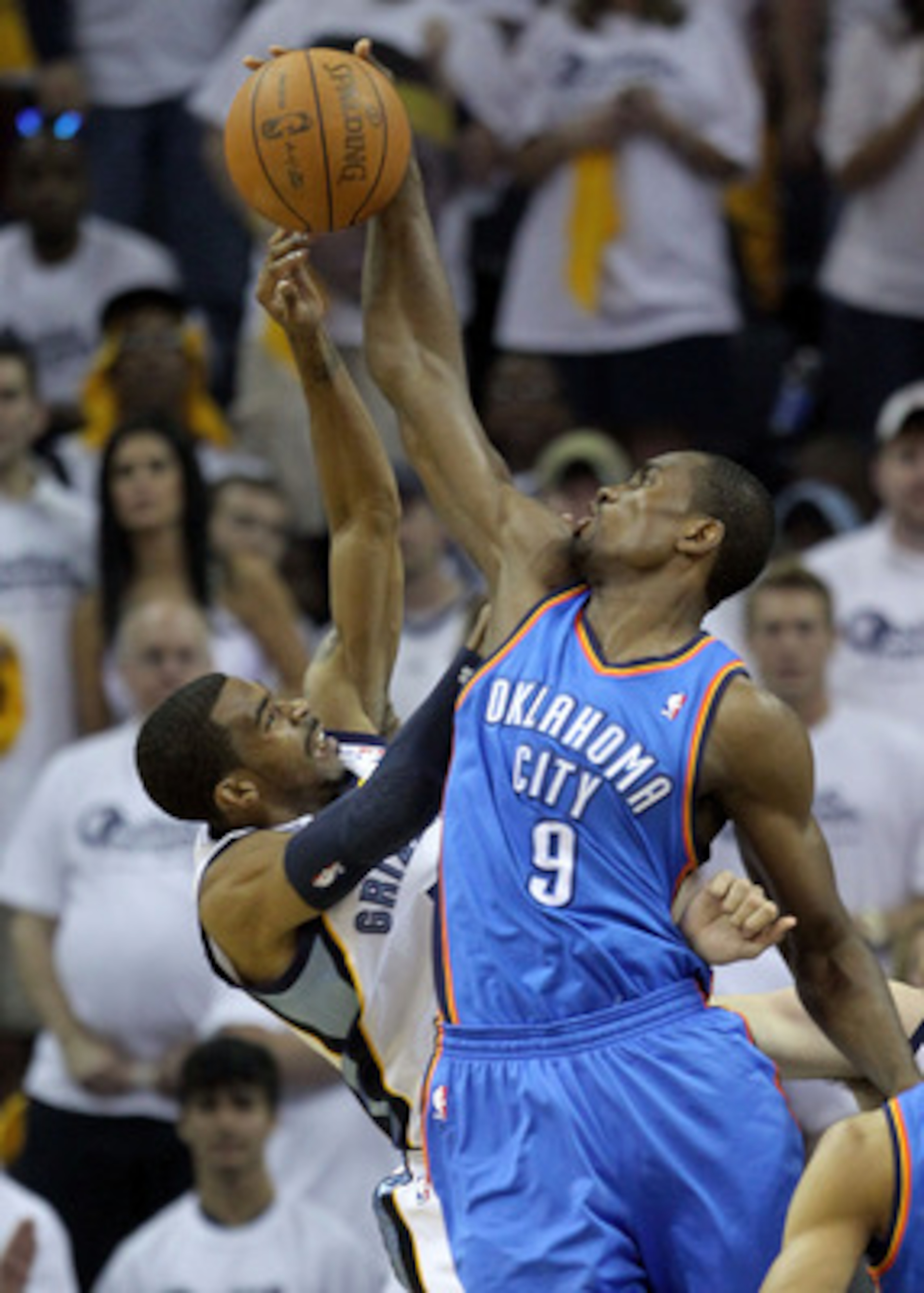 MEMPHIS, TN - MAY 07:  Serge Ibaka #9 of the Oklahoma City Thunder blocks the shot of Mike Conley #11 of the Memphis Grizzlies in Game Three of the Western Conference Semifinals in the 2011 NBA Playoffs at FedExForum on May 7, 2011 in Memphis, Tennessee.