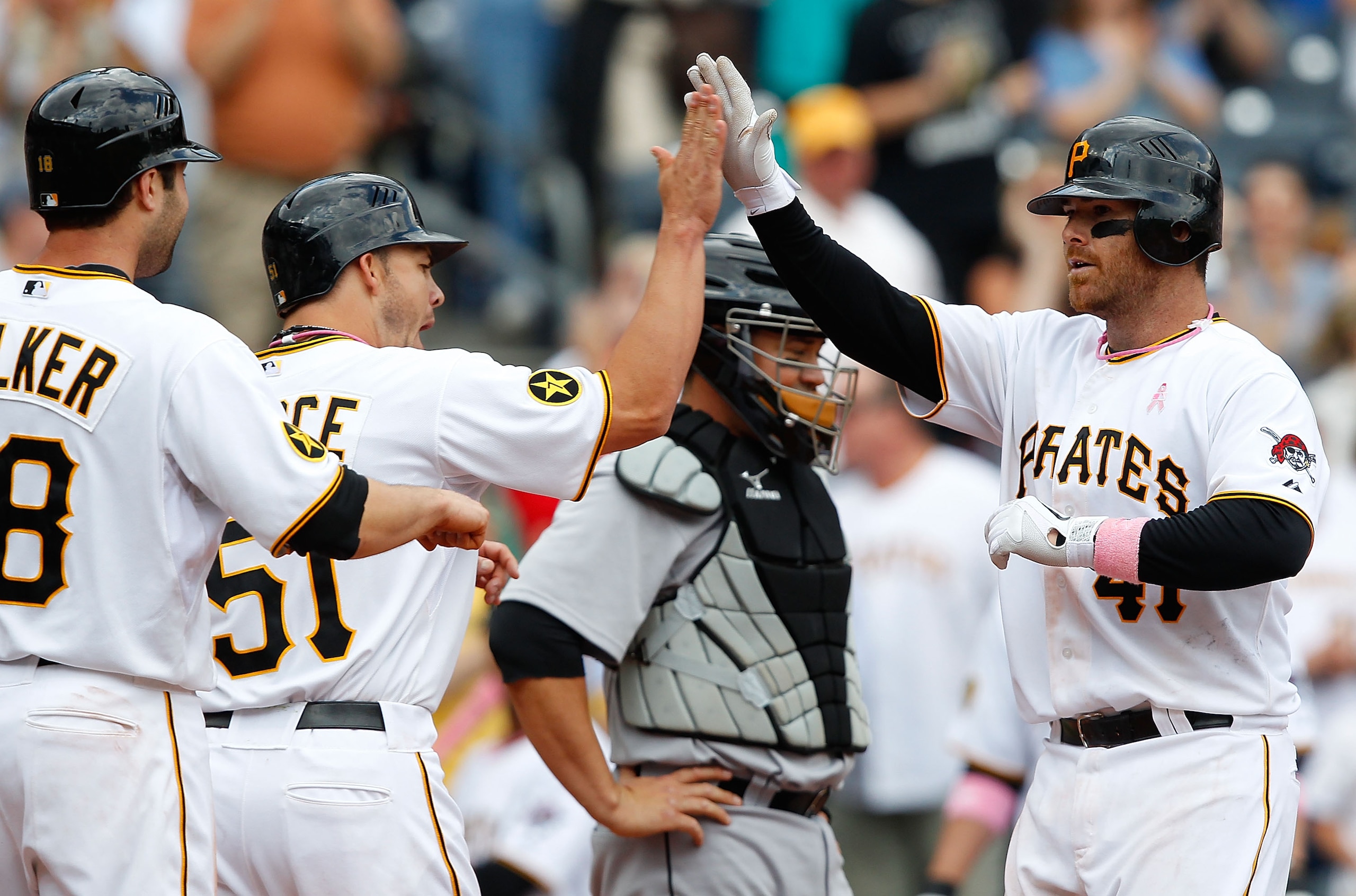 PITTSBURGH - MAY 08:  Ryan Doumit #41 of the Pittsburgh Pirates celebrates with teammates Steve Pearce #51 and Neil Walker #18 after hitting a three run home run against the Houston Astros during the game on May 8, 2011 at PNC Park in Pittsburgh, Pennsylv